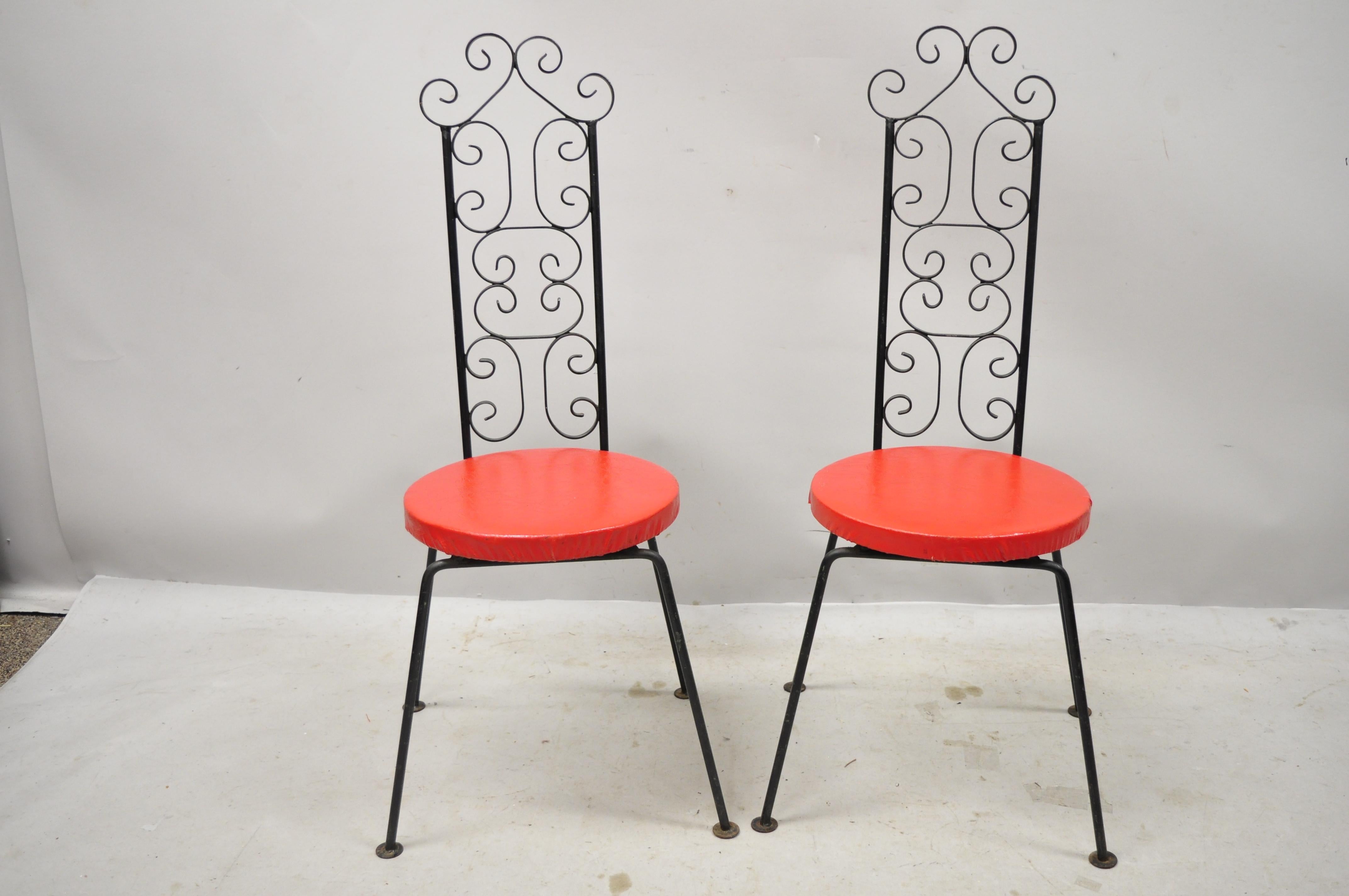 Mid-Century Modern Salterini style wrought iron tip top equipment inc scrolling side chairs - a pair. Item features fancy scrollwork back, round vinyl upholstered seat, wrought iron construction, original label, very nice vintage pair, great style