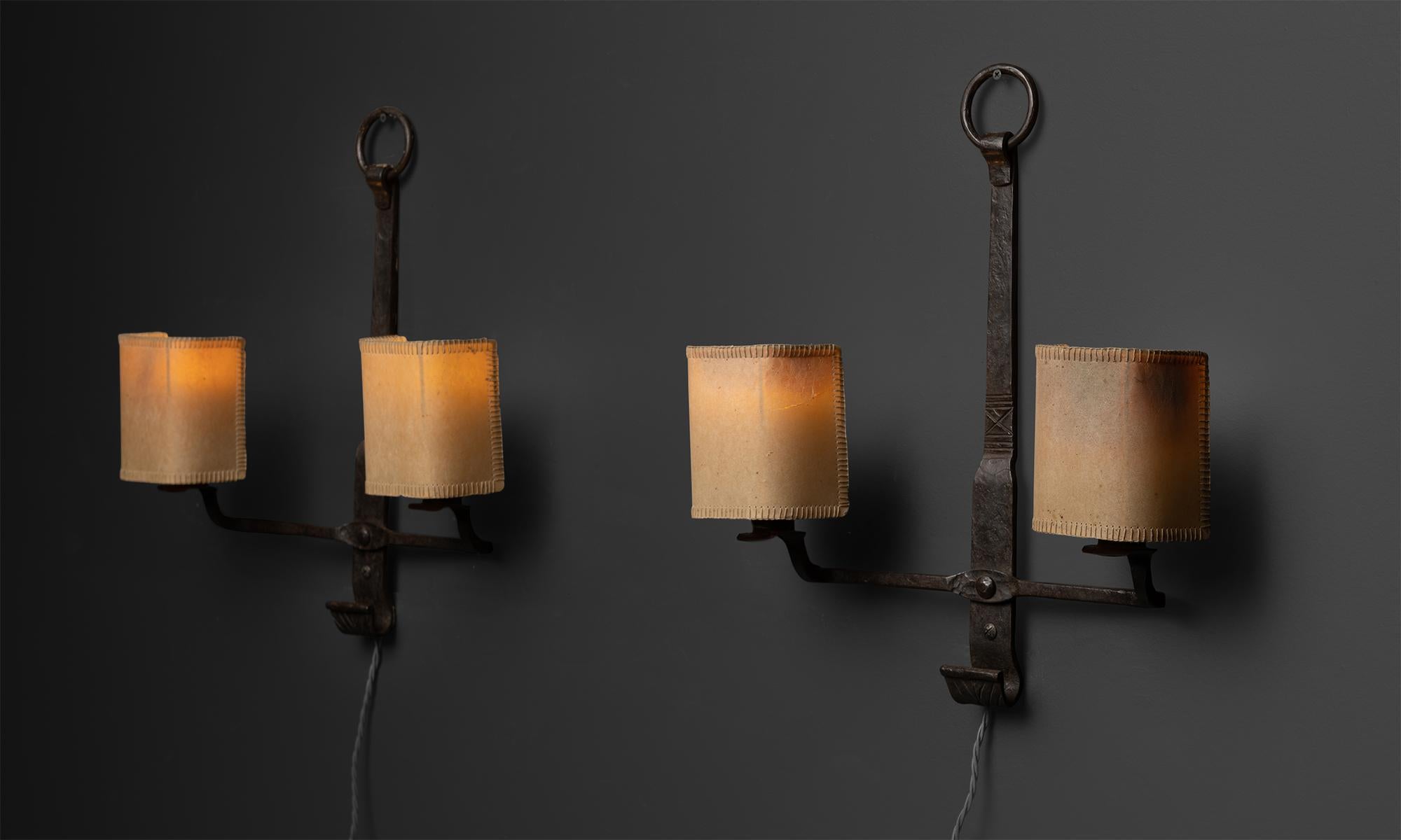 *Please note the price is per unit*

Wrought Iron & Vellum Sconces, England circa 1920

Wrought iron fixture with handstitched vellum shades

Measures 17.5”w x 5”d x 19”h

Not UL Listed.