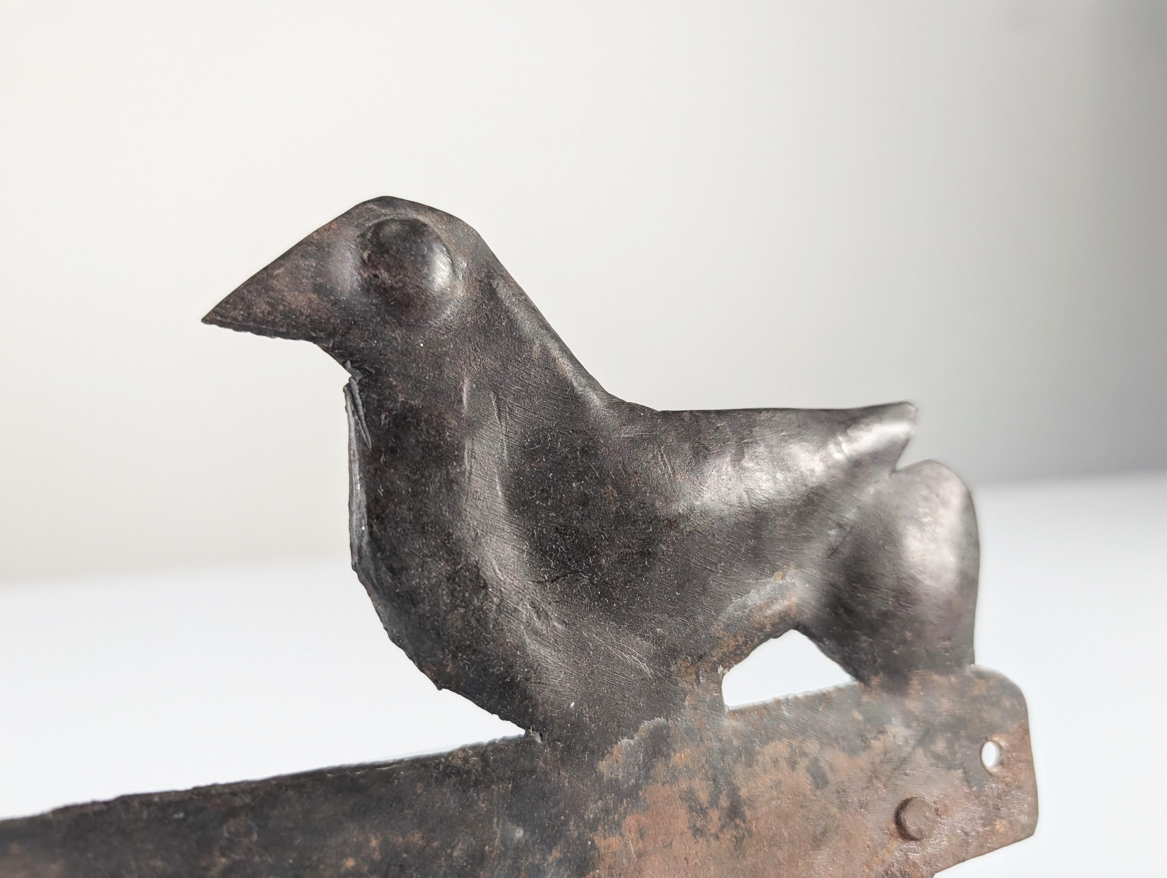 Charming wall-mounted wrought iron coat rack attributed to Atelier Marolles, the renowned French artistic workshop founded in the 1950s by Jean Touret. Featuring a design of two birds in its characteristic simplistic and symbolic style, it reflects
