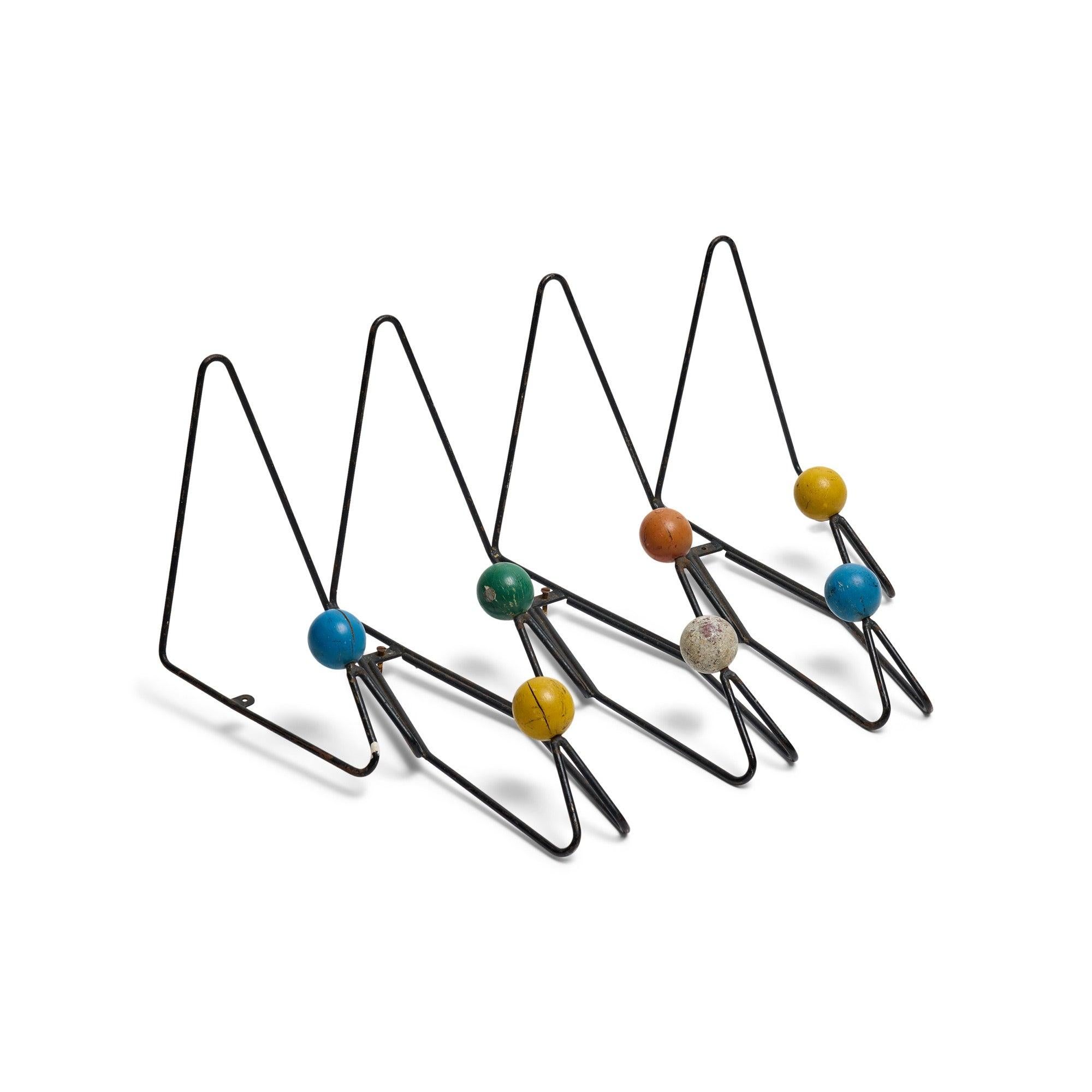 A wrought iron wall rack.