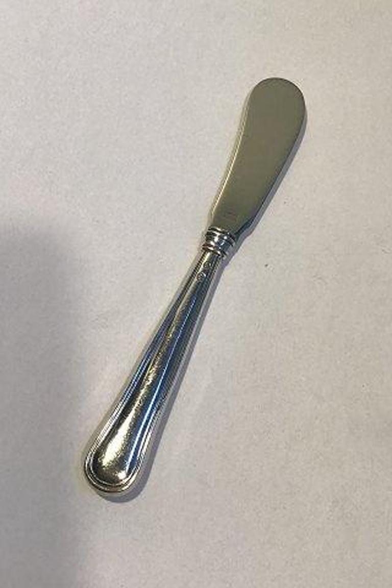 W&S Sørensen Dobbeltriflet Old Danish silver butter knife.

Measures 16.3 cm(6 27/64 in).
  