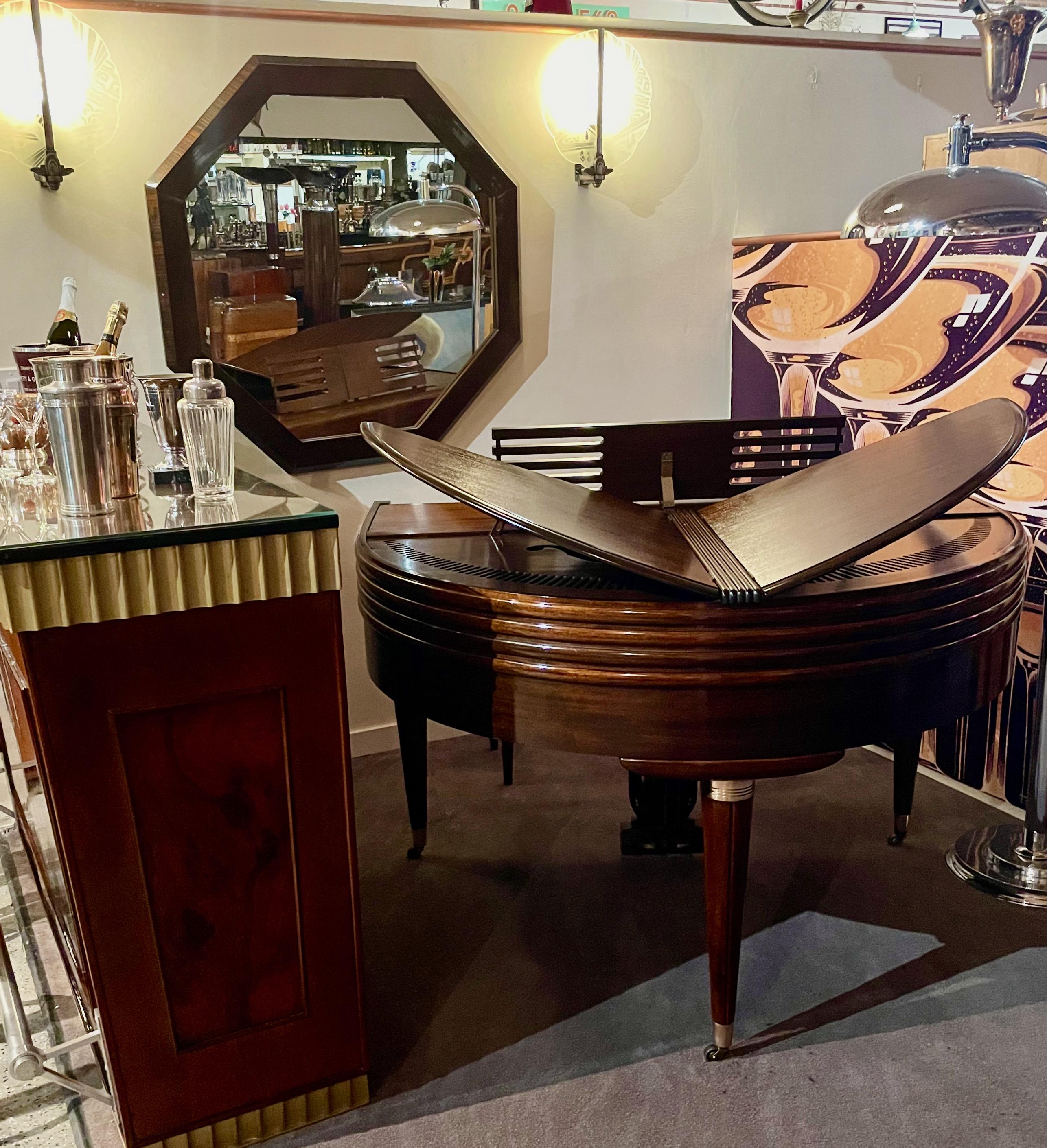 This 1937 Streamline Art Deco butterfly Wurlitzer Baby grand piano. Wurlitzer 88 key Deluxe has been positively identified as the style 1411. Of the Wurlitzer Butterfly Pianos, this model has the best detail. It has a unique winged shape and is one