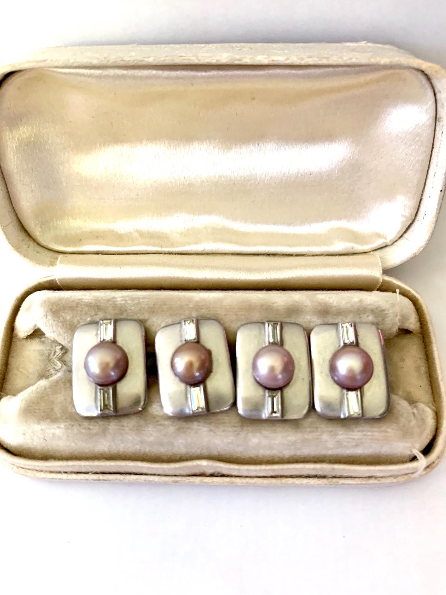These cufflinks are totally stylish as they are beautifully adorned with diamonds and a pearl on both sides of the platinum setting.

They are in their original W.W. Wattles & Sons case. 

They measures 1/2