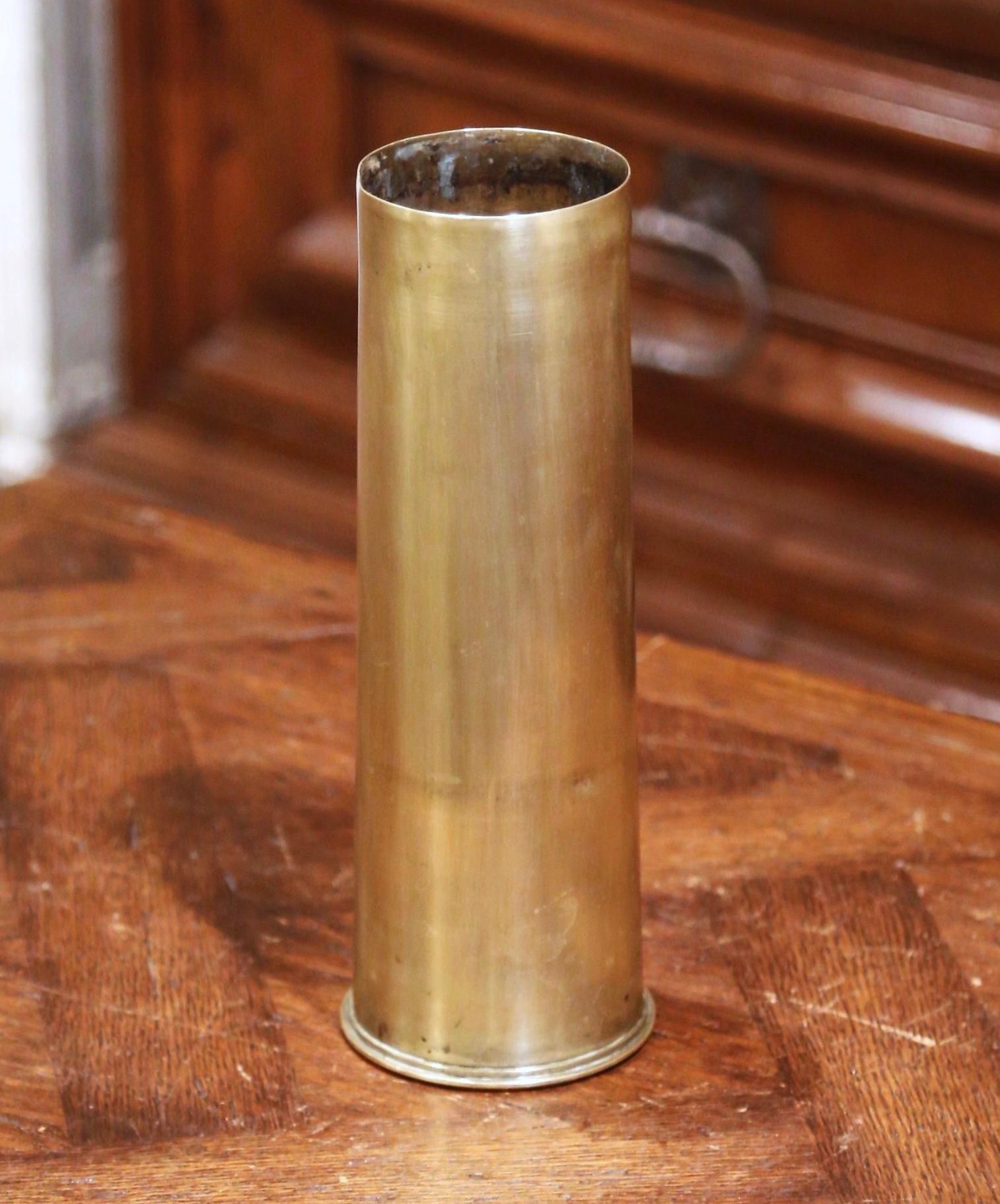 Take a piece of history into your home with this authentic English shell casing from the First World War (WWI 1914-1918). Made of brass, the impressive piece of artillery is round in shape and dated on the bottom 1918. The memorabilia souvenir is in