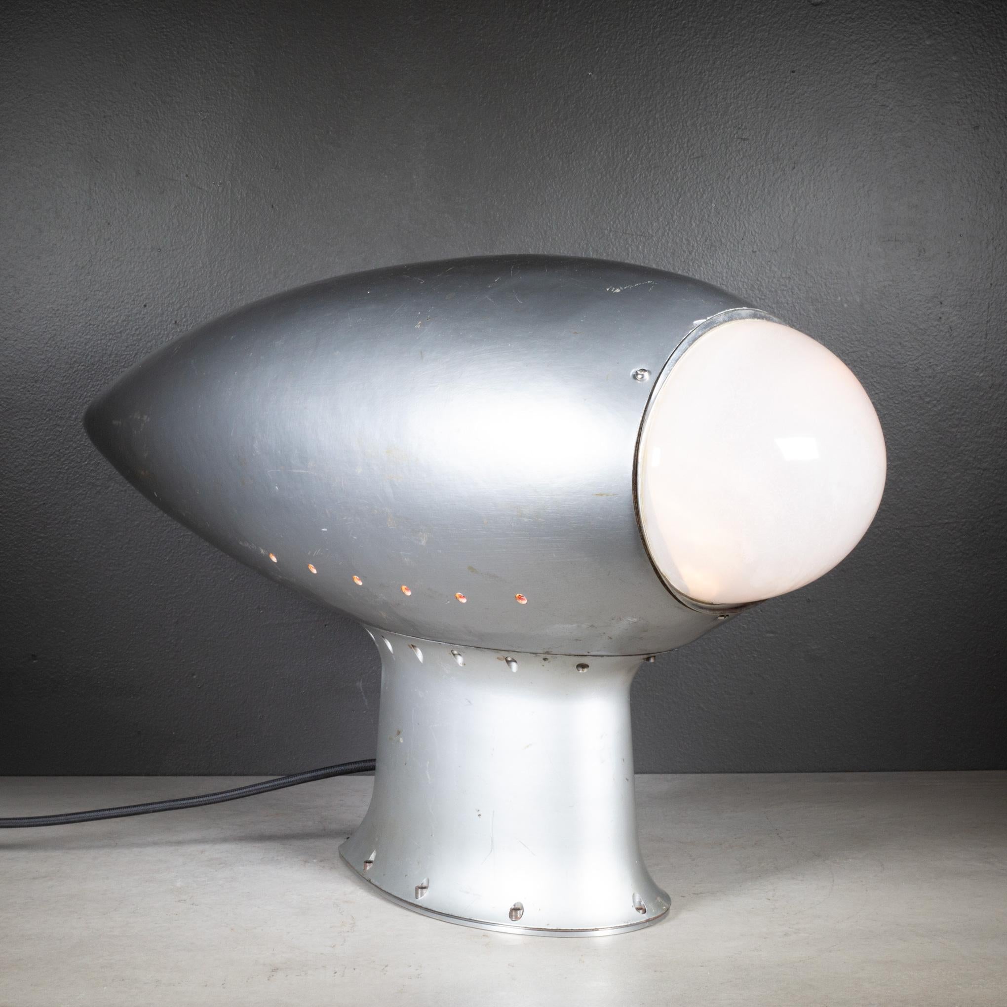 ABOUT

A WW2 era B-17 Flying Fortress B-17 bomber radio repurposed as a table lamp with new black, fabric cord. 
This item has been shop tested and works.

    CREATOR Boeing. 
    DATE OF MANUFACTURE c.1940-1945. 
    MATERIALS AND TECHNIQUES