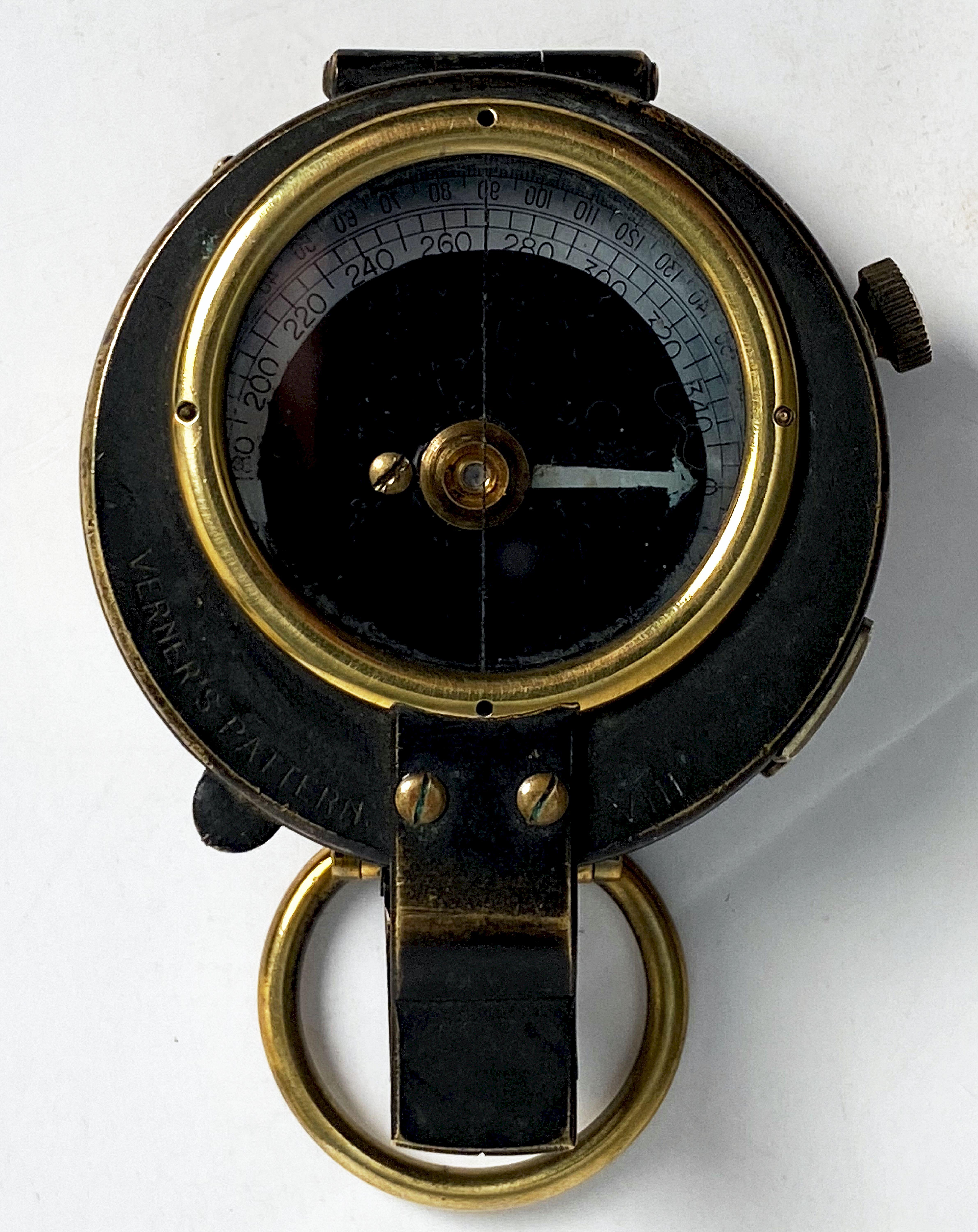 A working military officer's marching or sighting compass of heavy brass from World War One, dated 1918 - an excellent original example of the MK VIII. Featuring a brass case and mounted with a lanyard ring. The glass face and numbered brass outer