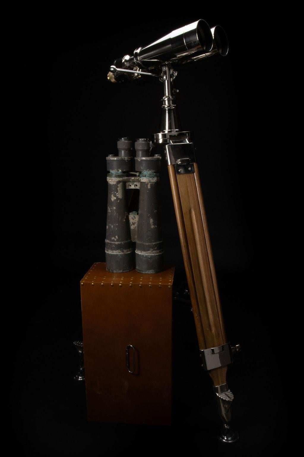 Nikon marine binoculars mounted on a wooden period tripod, these exceptional binoculars display entirely Original optics in a distinctly Japanese bulletproof straight-body instrument with 15 x magnification with 80 mm objective naval lens that have