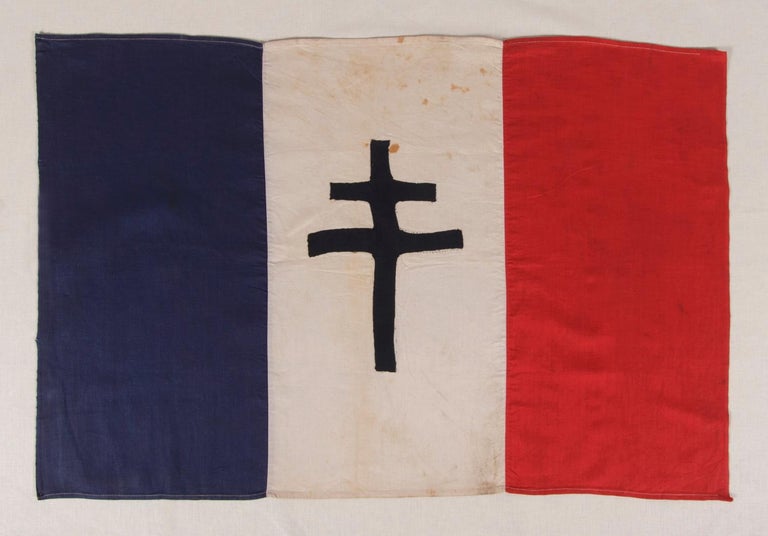 WWII PERIOD FRENCH FLAG WITH THE CROSS OF LORRAINE, THE SYMBOL OF THE FREE FRENCH, CA 1940-1945 

WWII French flag featuring the Cross of Lorraine, the symbol of the Free French. The Free French were individuals or military units that help form the