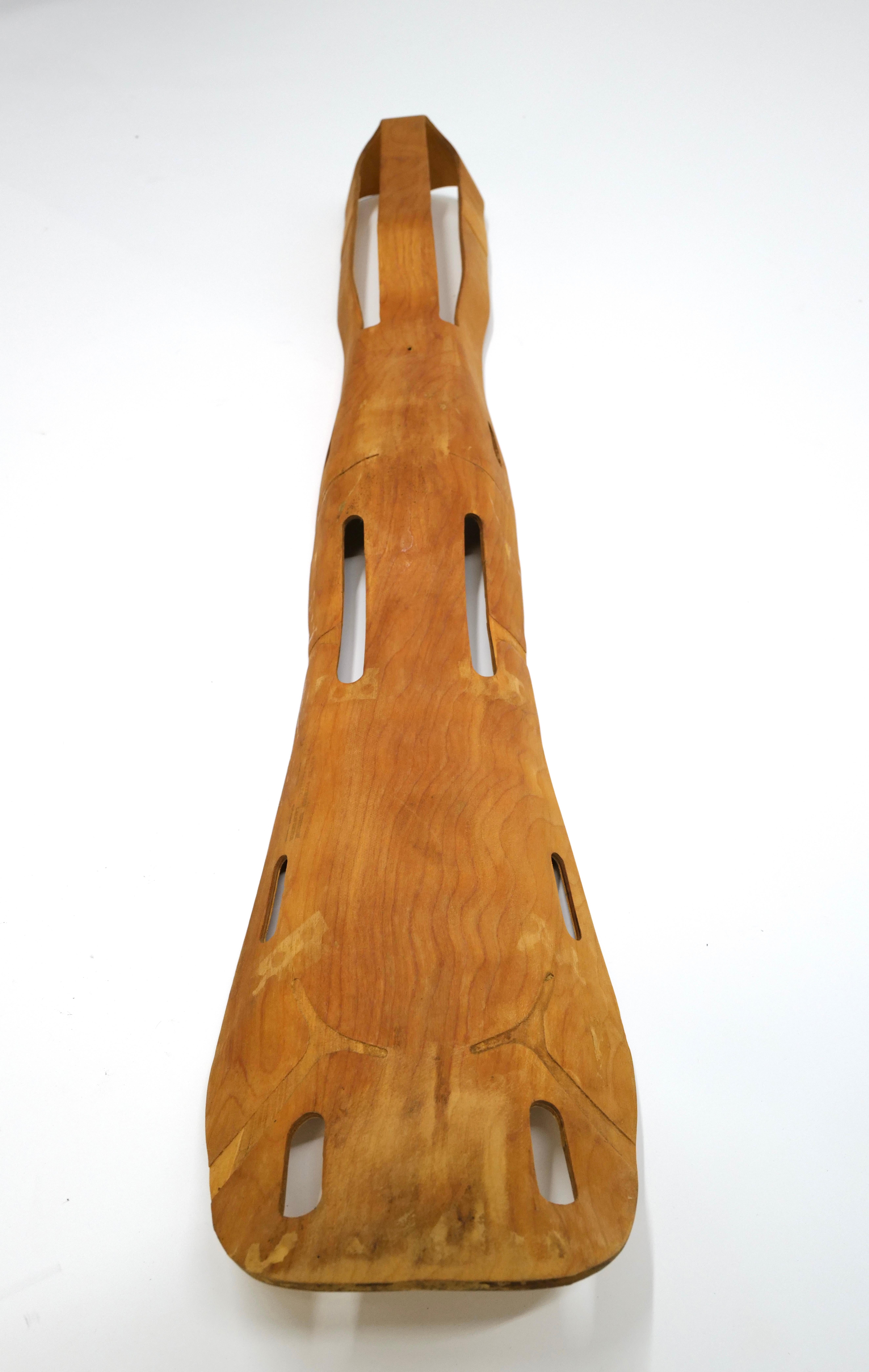 The WWII molded plywood leg splint, designed by Charles Eames and manufactured by Evans Mfg., is a pioneering example of functional design and innovative use of materials. Created in 1942, this leg splint was developed in response to the U.S. Navy's