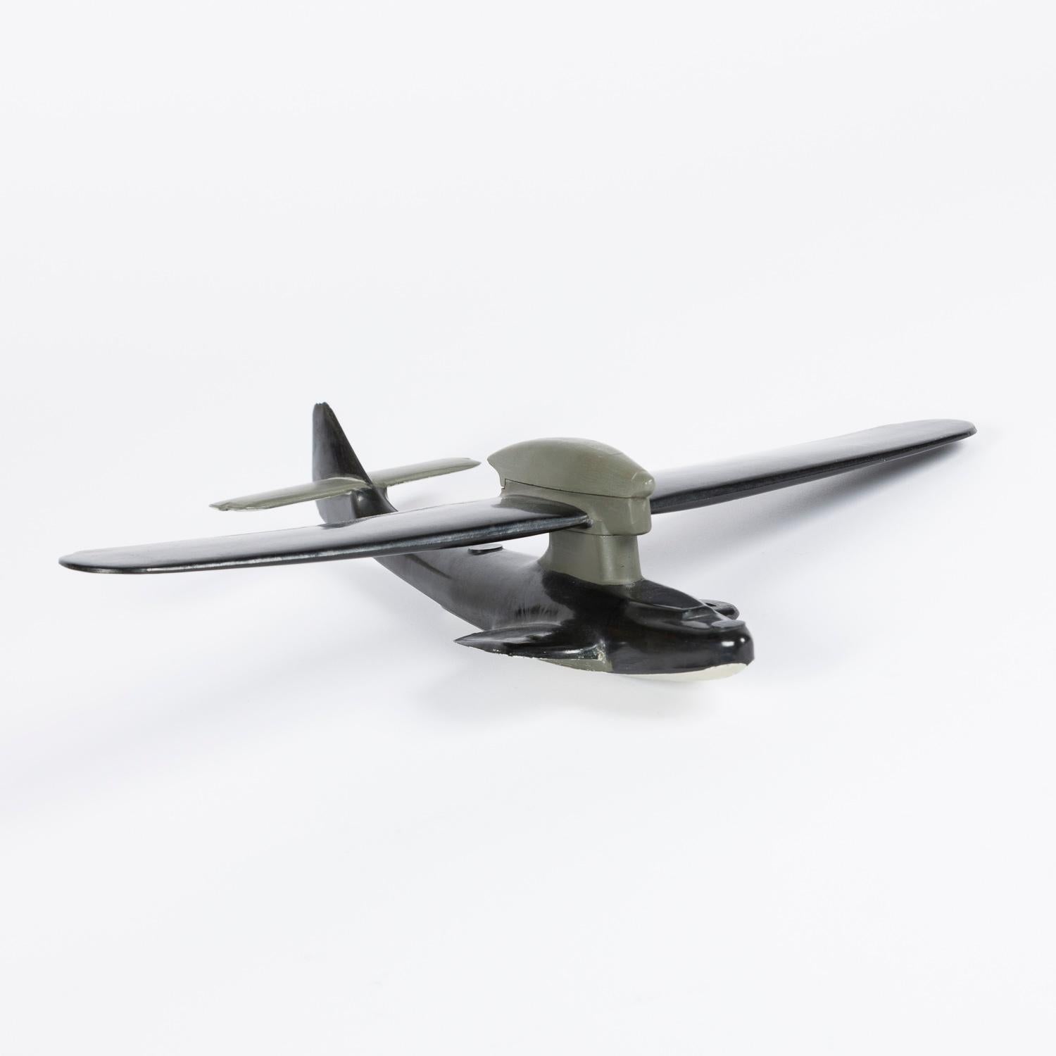 WWII Bakelite and painted wood recognition model of a Dornier Do.18 flying boat.

1:72 scale.



The Dornier Do 18 flying boat was developed for the Luftwaffe, although LuftHansa received five aircraft and used these for tests between the Azores and