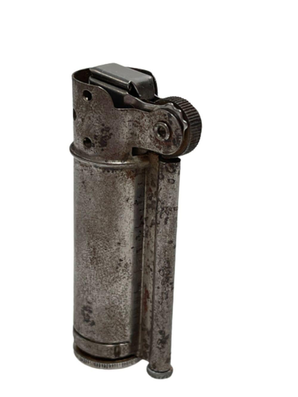 This antique Dunhill Service Lighter, crafted in the United States and originally intended for military use, dates back to 1940. It stands out as one of the rare Dunhill lighters designed for the masses. Constructed from sturdy steel, this Service