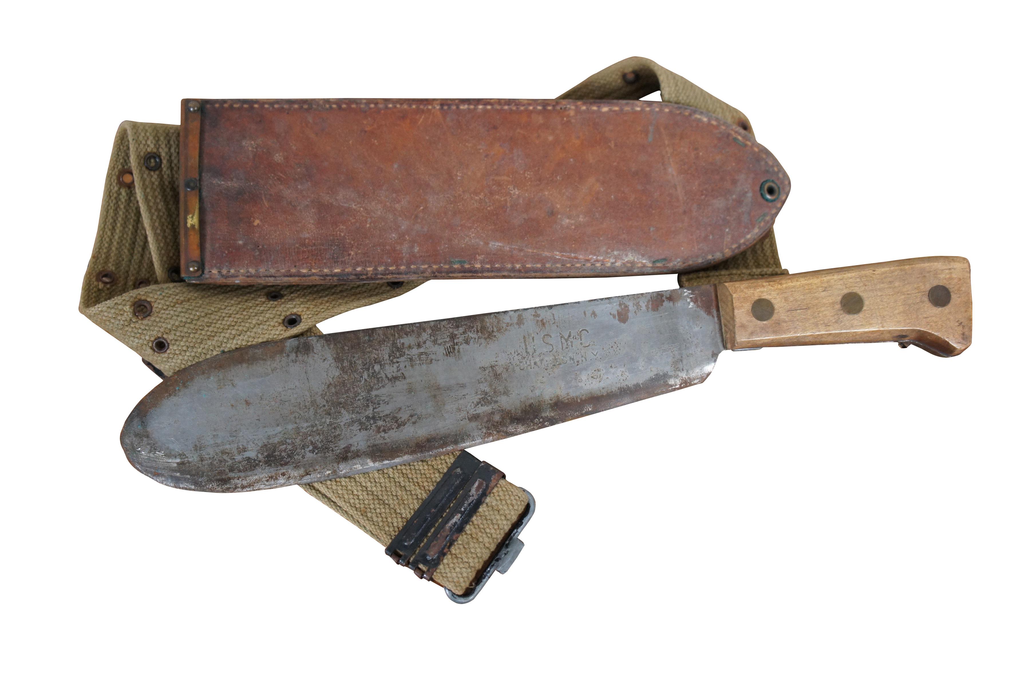 Antique 1944 World War II United States Marine Corps hospital corpsman bolo knife / machete. Round tipped bolo style blade marked USMC Chatillon, N.Y. Simple wood handle with three brass rivets. Brown leather scabbard with copper / brass top,