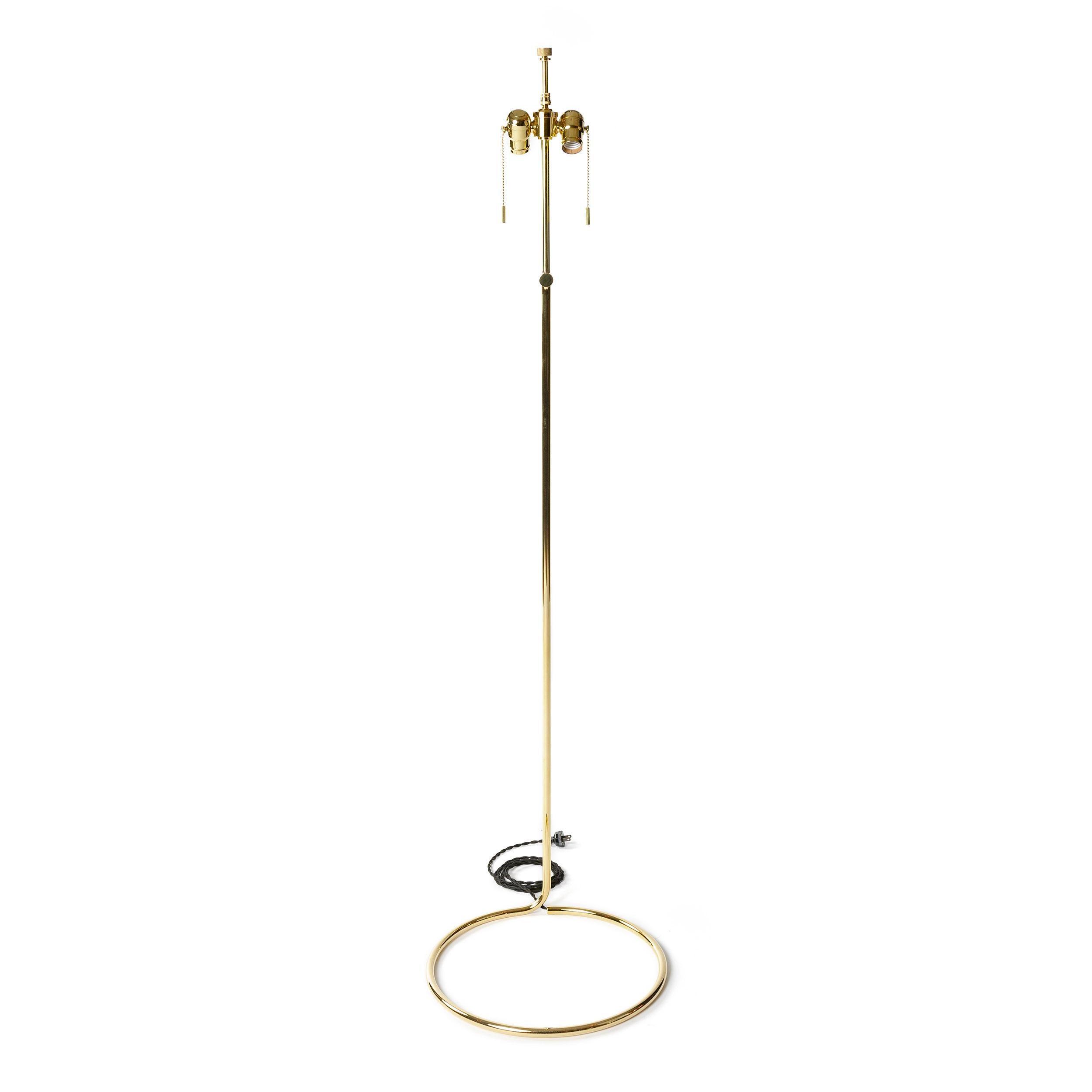 A spare, sinuous floor lamp made from a continuous coil of thinly gauged bronze tubing in a polished finish. Shade shown for sample only / not included. Designed and manufactured by Wyeth in the USA, 2017.