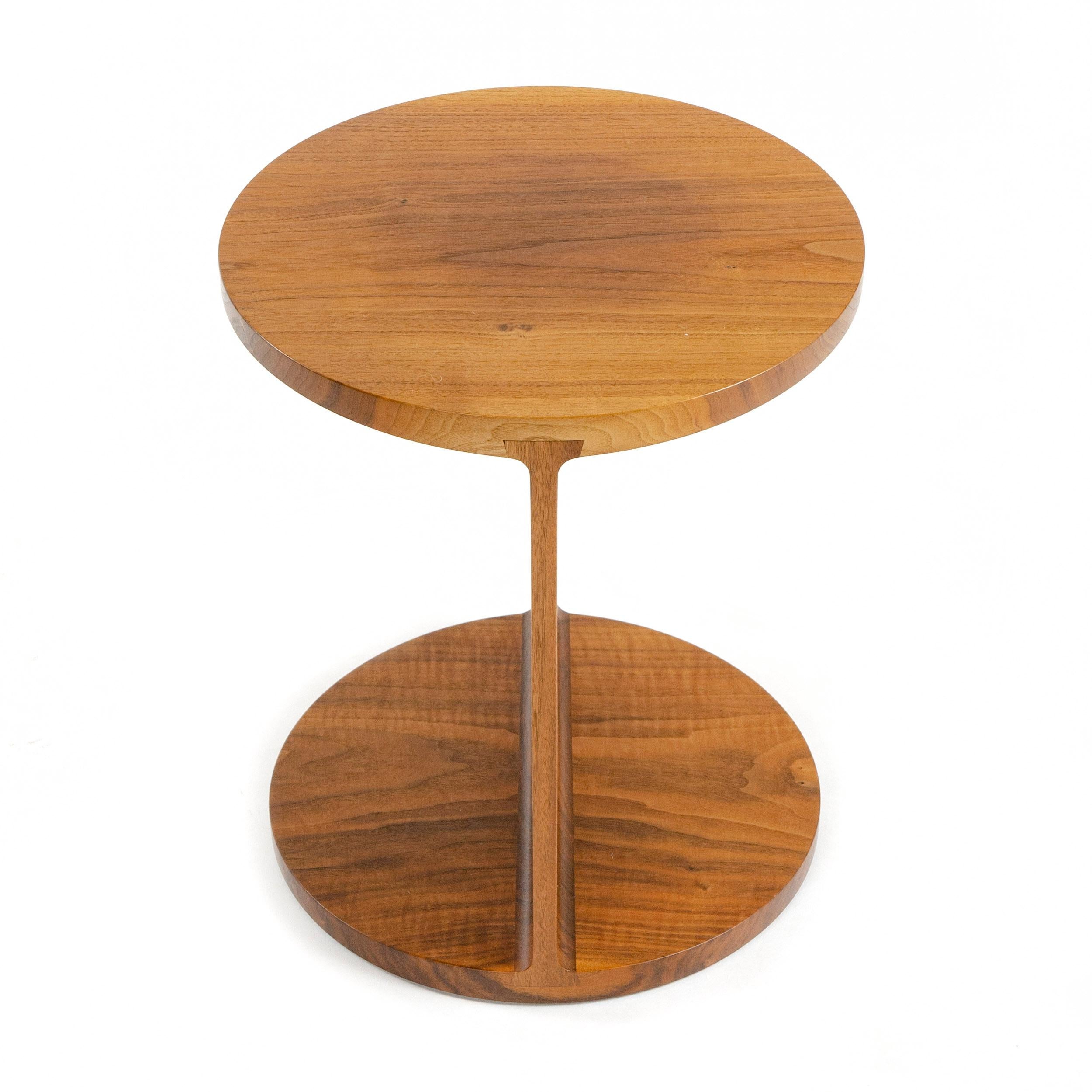 A Wyeth original round walnut I-beam side or end table.