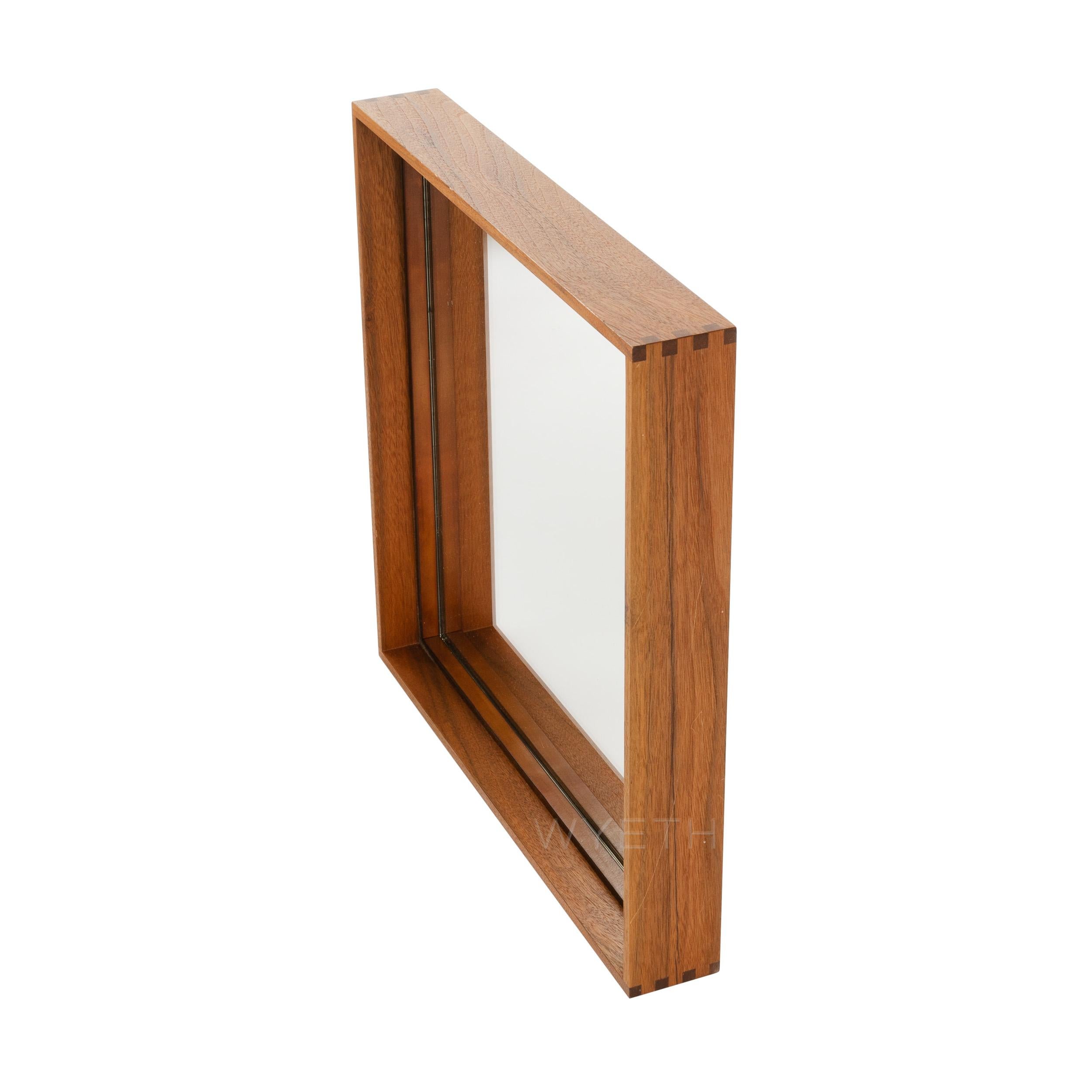 A Wyeth original, thin edge wood mirror with box cut corners in walnut. Available in custom sizes.