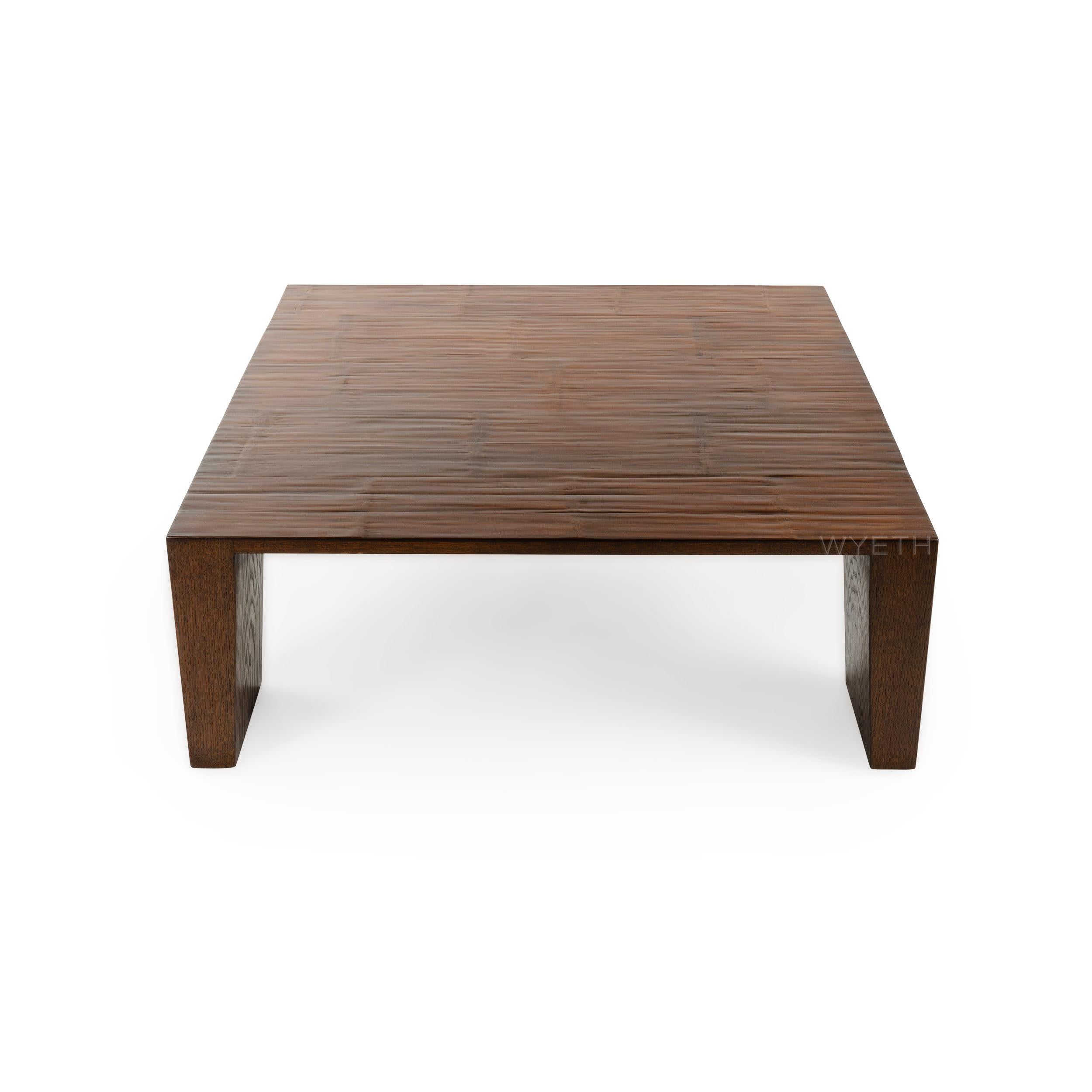A well-crafted square low table with a split bamboo top and end legs.