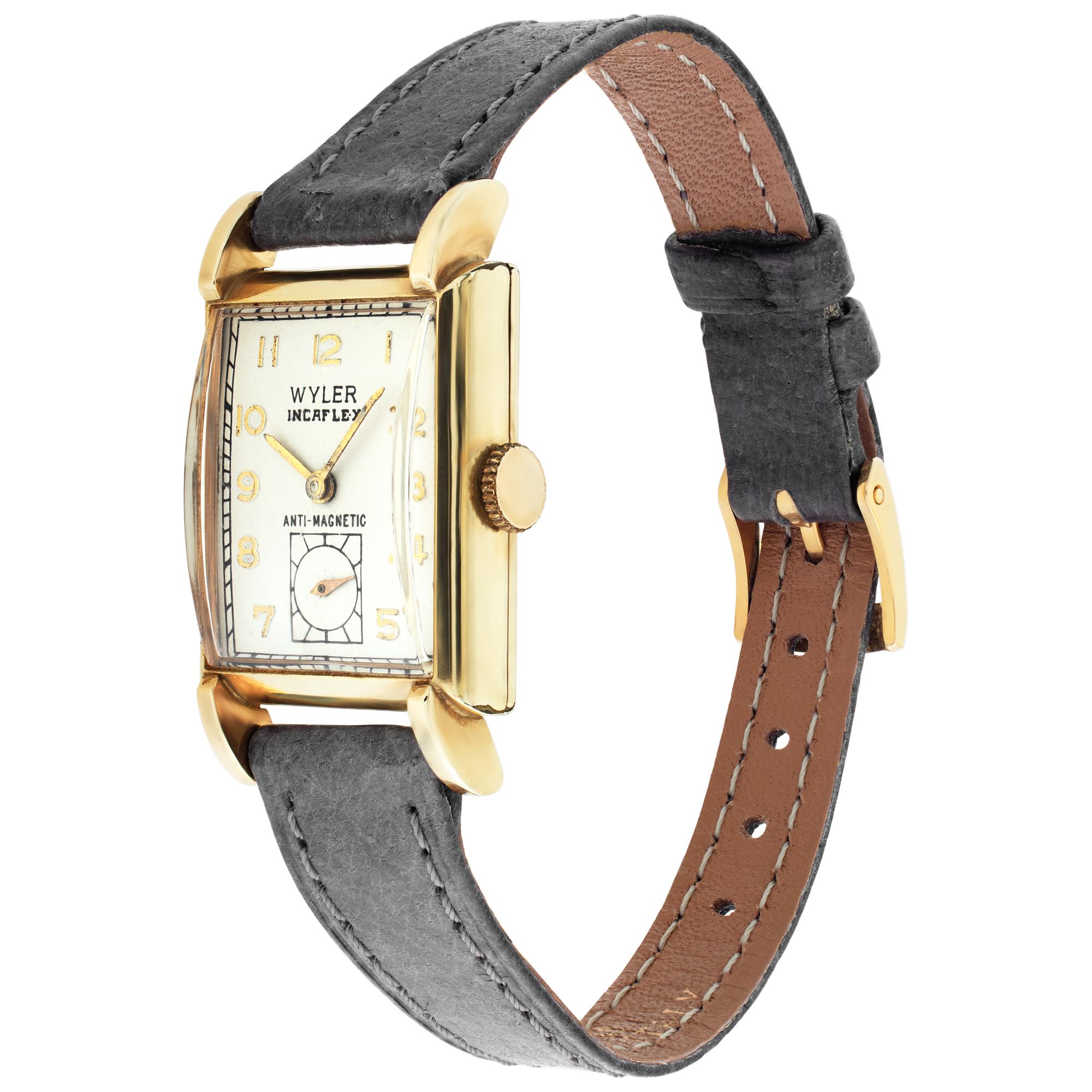 Unisex Wyler Incaflex anti-magnetic gold fill case, gold fill bezel,  leather band with two piece clasp. Manual w/ sub-seconds . Certified pre-owned. Circa 1940. Fine Pre-owned Wyler Watch. Certified preowned Vintage Wyler watch on a Gray Leather