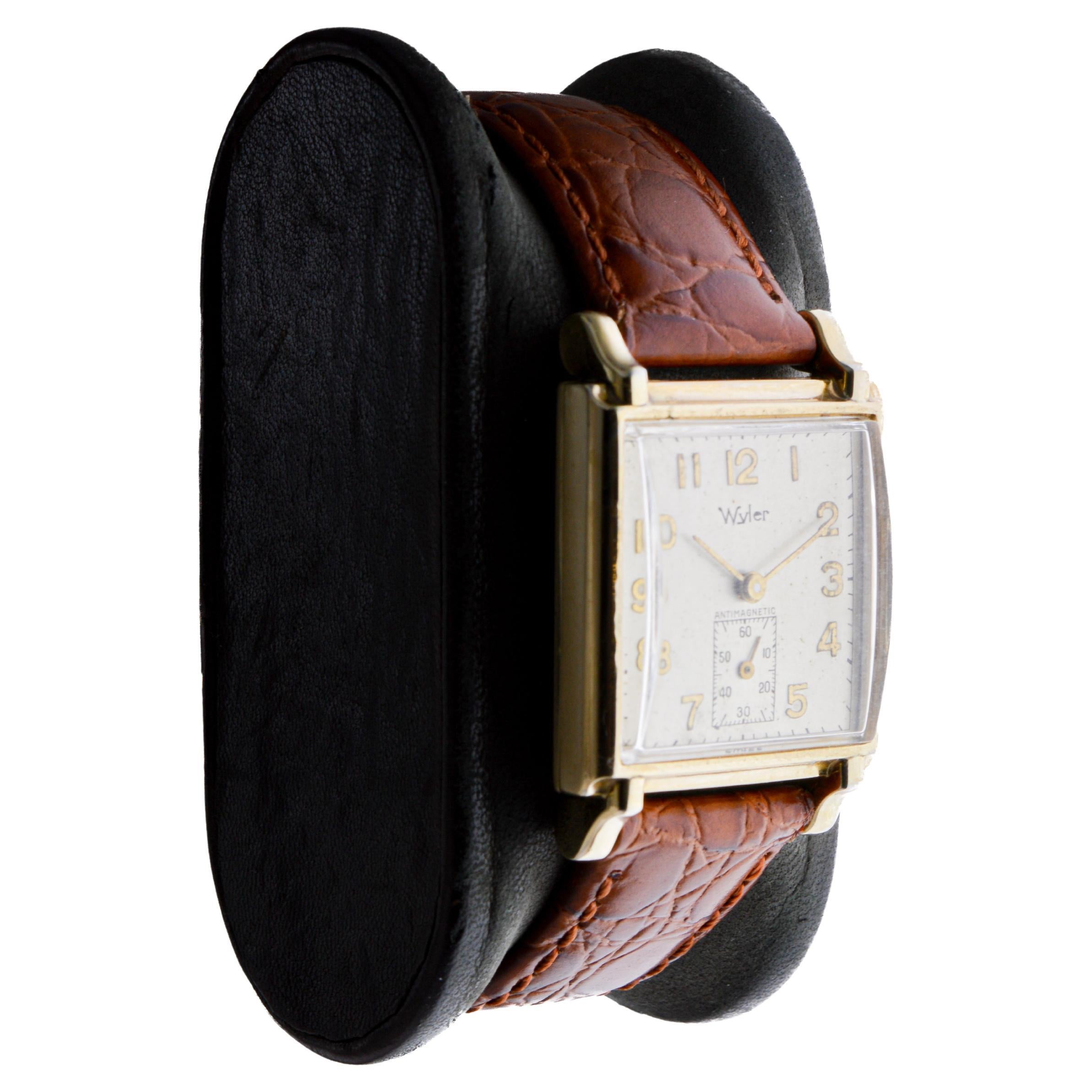 FACTORY / HOUSE: Wyler Watch Company
STYLE / REFERENCE: Art Deco / Tank Style
METAL / MATERIAL: Yellow Gold Filled
CIRCA / YEAR: 1940's
DIMENSIONS / SIZE: Length 35mm, Lug Tip to Lug Tip / Width 24mm
MOVEMENT / CALIBER: Manual Winding / 15 Jewels