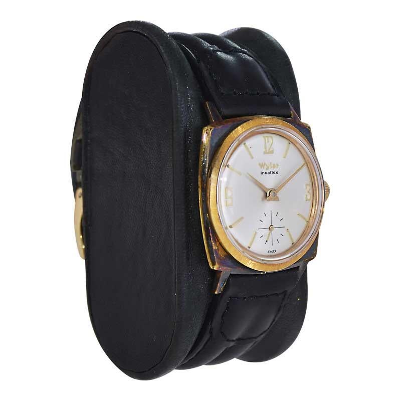 FACTORY / HOUSE: Wyler Watch Company
STYLE / REFERENCE: Moderne / Cushion Shape
METAL / MATERIAL: Gold Filled 
CIRCA / YEAR: 1960's
DIMENSIONS / SIZE: Length 36mm X Width 30mm
MOVEMENT / CALIBER: Manual Winding / 17 Jewels / Incaflex
DIAL / HANDS: