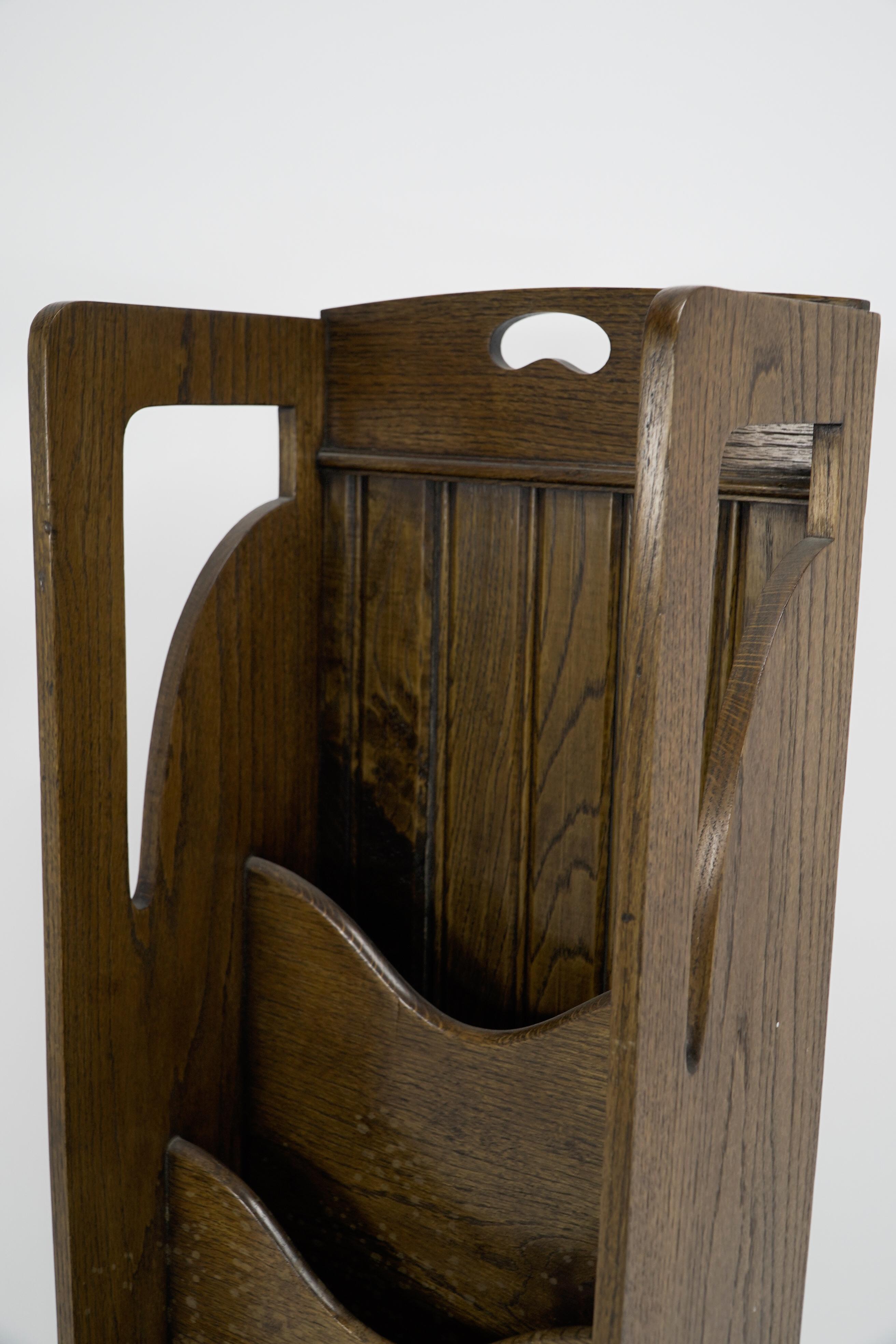 Wylie and Lochhead attributed. A Glasgow Style Arts and Crafts oak magazine rack For Sale 1