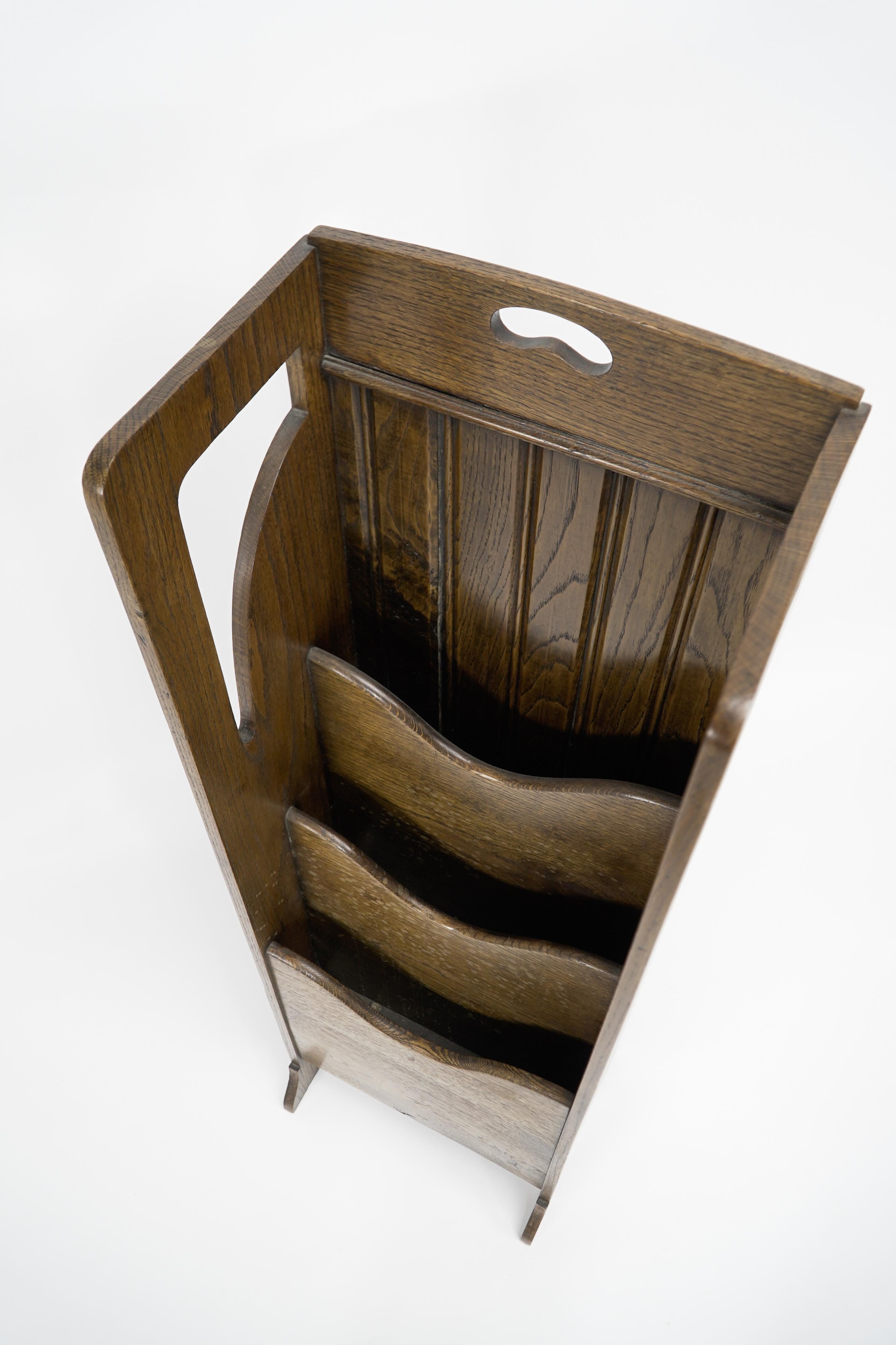 Oak Wylie and Lochhead attributed. A Glasgow Style Arts and Crafts oak magazine rack For Sale