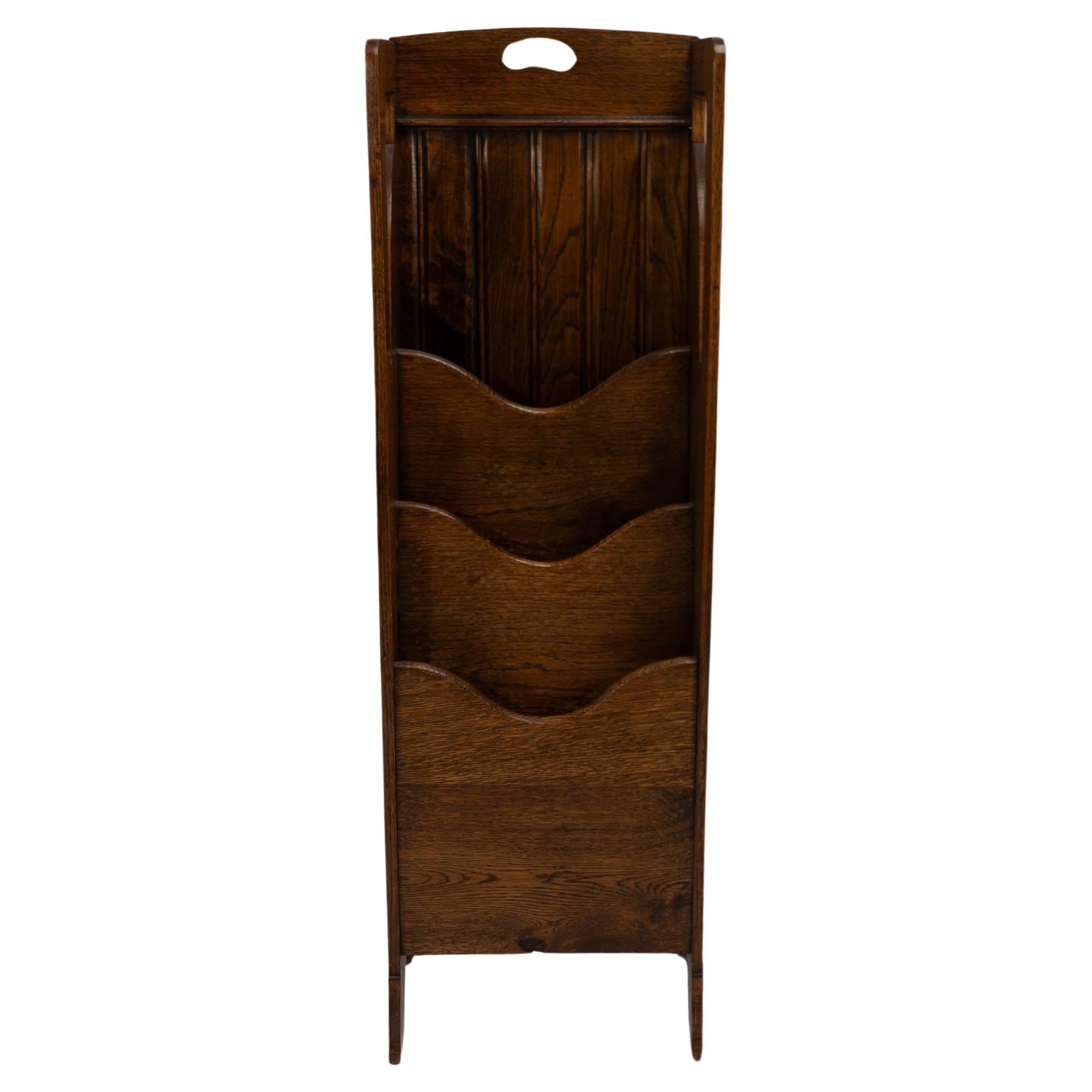 Wylie and Lochhead attributed. A Glasgow Style Arts and Crafts oak magazine rack