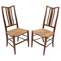 Antique Wylie and Lochhead (attributed). A pair of rush seated side or bedroom chairs