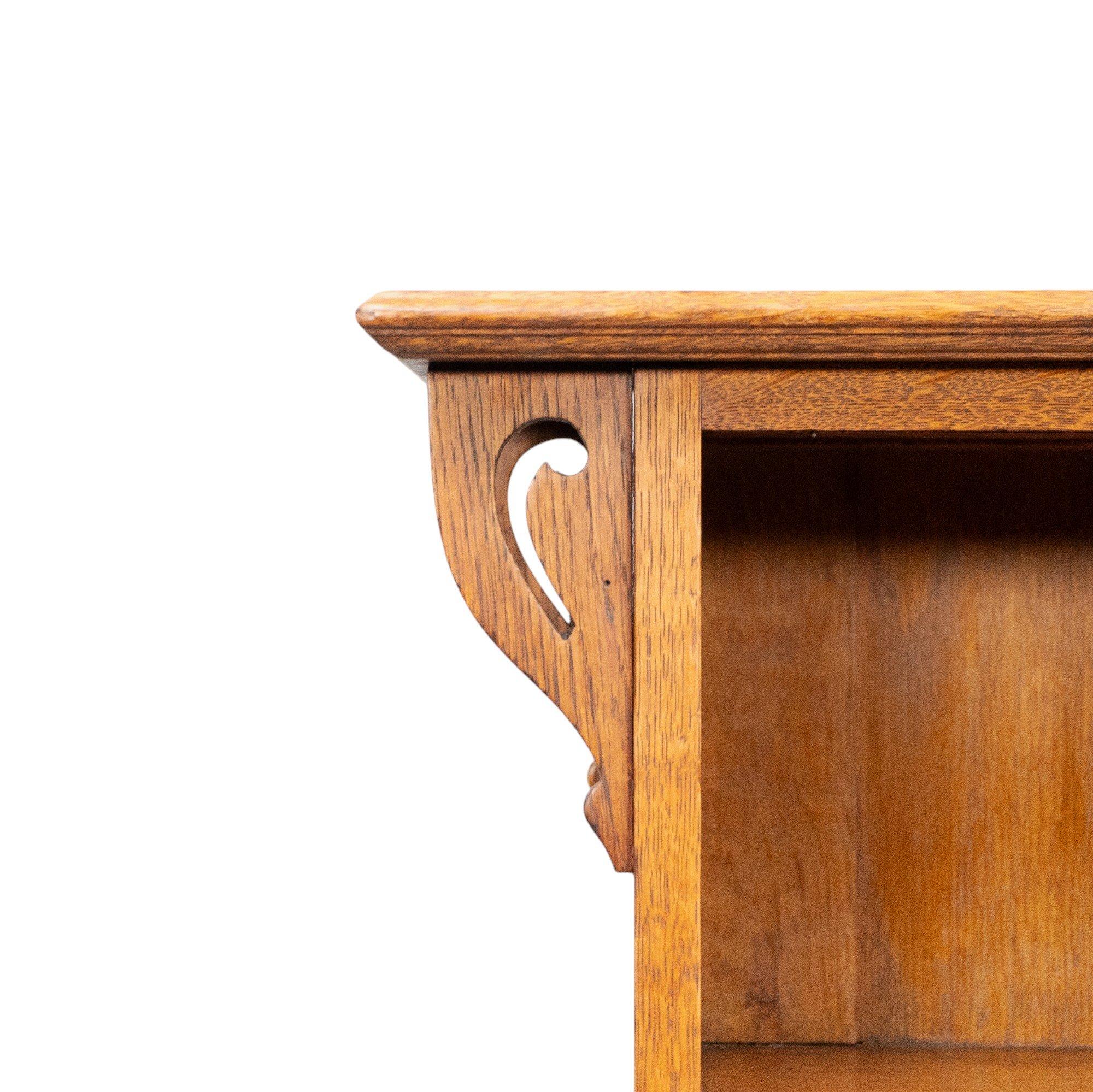 20th Century Wylie and Lochhead, in the style of. Arts and Crafts oak bookcase with cupboard For Sale