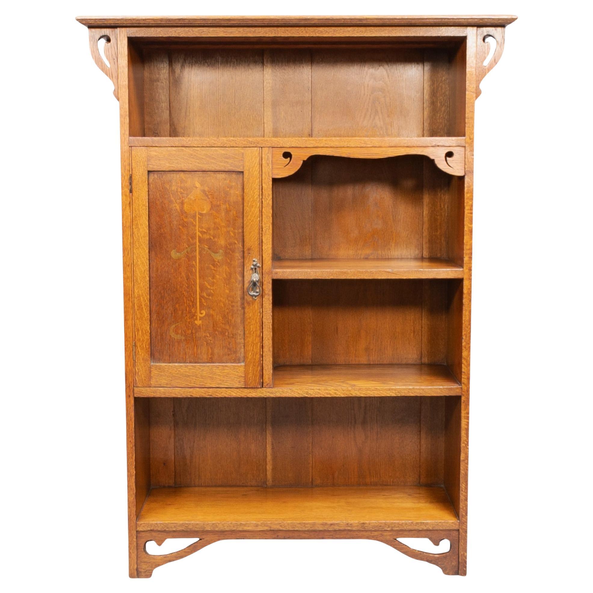 Wylie and Lochhead, in the style of. Arts and Crafts oak bookcase with cupboard For Sale