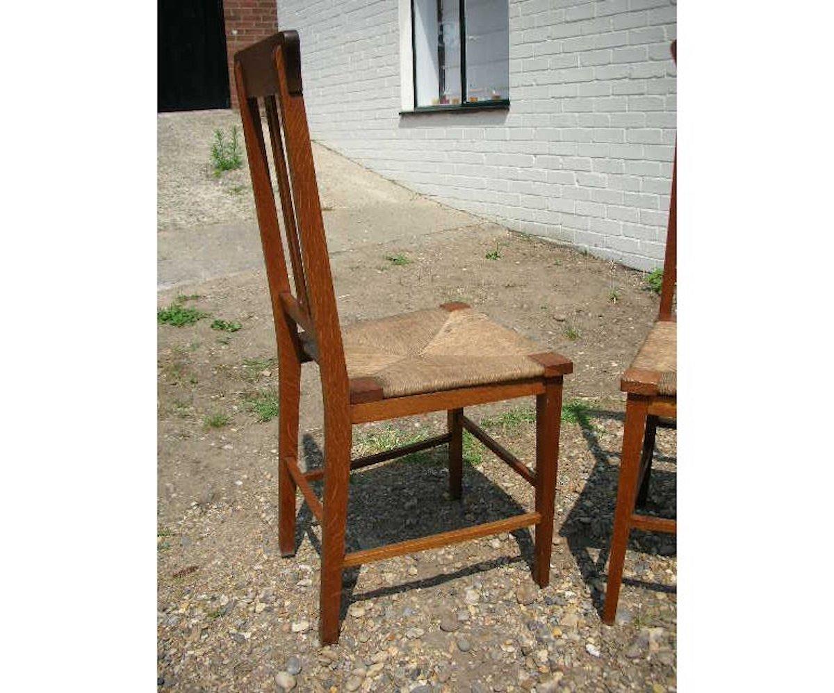 English Wylie & Lochhead, a Pair of Glasgow School Oak Arts & Crafts Bedroom Chairs