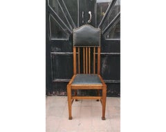 Wylie & Lochhead Attri. a Set of Four English Arts and Crafts Oak Dining Chairs