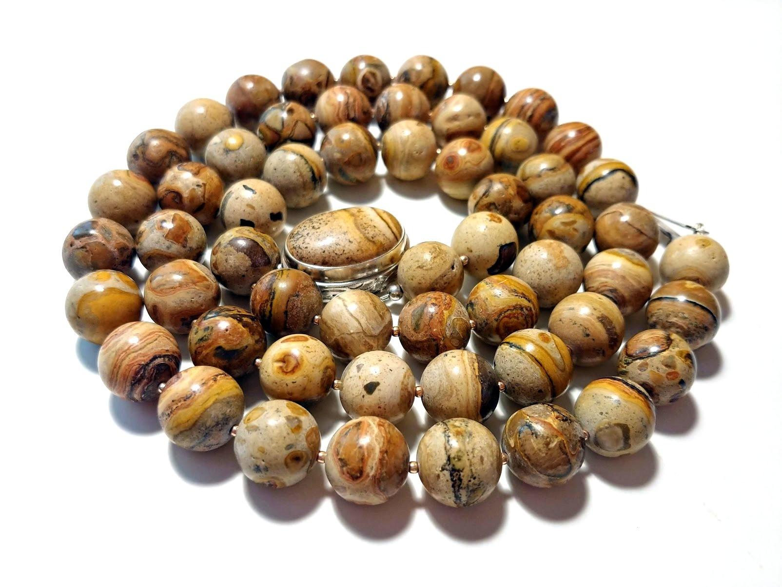 The length of the necklace is 34.5 inches (87.6 cm). The size of the round beads is 14 mm.
This necklace has incredibly warm, soft, and tasty shades.
Picture Jasper is an opaque, microcrystalline variety of Quartz with extraordinary color