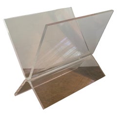 Soporte para revistas y lucita con base en "X" al estilo de Charles Hollis Jones