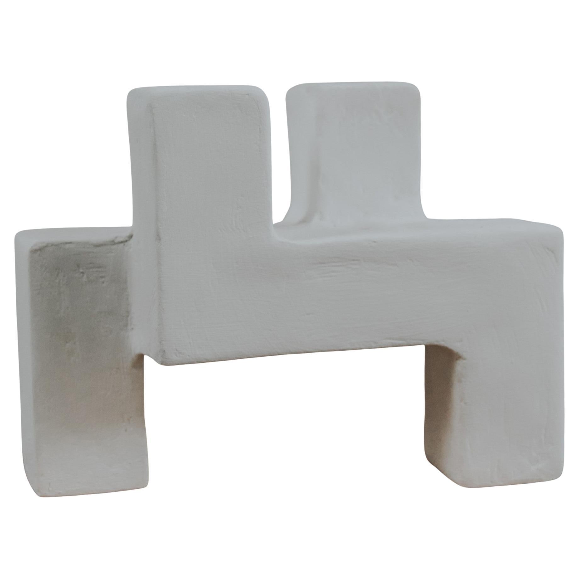 An abstract take on the letters X, Y, and Z, this collection of three candle holders is an elegant addition to any living room or dining table. With its organic but monolithic curves and clean texture, these hand-sculpted candle holders are made