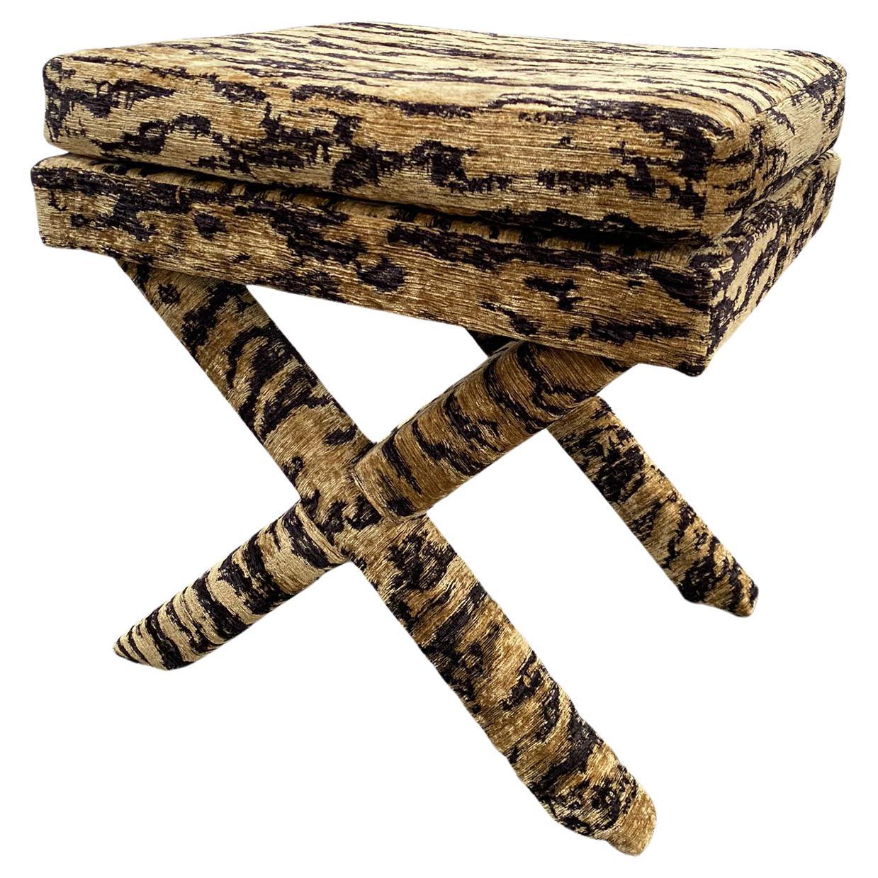 A wonderful X-frame stool (pair available) Originally retailed by luxury retailers Harrods Ltd, London in the 1970's the original fabric was a tiger skin fabric. We have re-upholstered in a fabulous quality woven tiger skin chenille fabric by