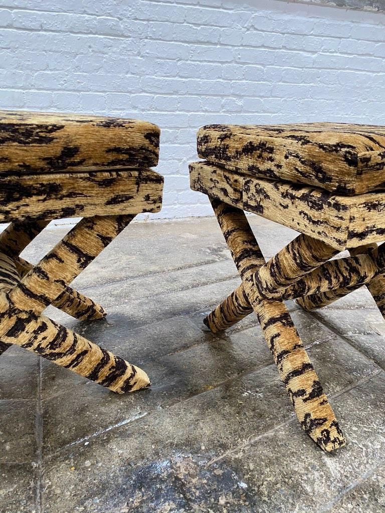 A wonderful X-frame stool (pair available) Originally retailed by luxury retailers Harrods Ltd, London in the 1970's the original fabric was a tiger skin fabric. We have re-upholstered in a fabulous quality woven tiger skin chenille fabric by