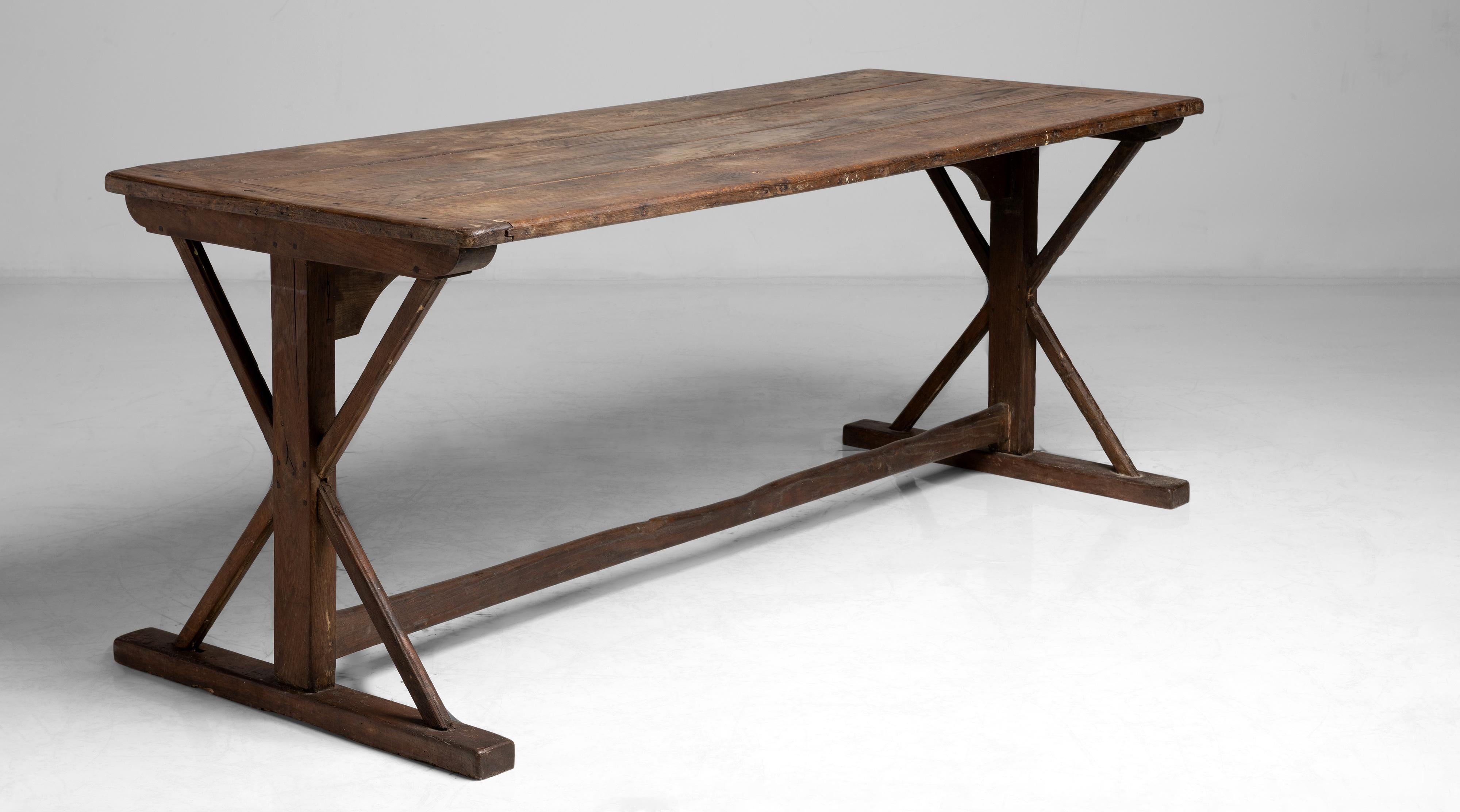 X-Frame tavern table
England, circa 1890
Constructed in oak with natural patin.
Measures: 72”L x 28.5”D x 27.75”H.
 