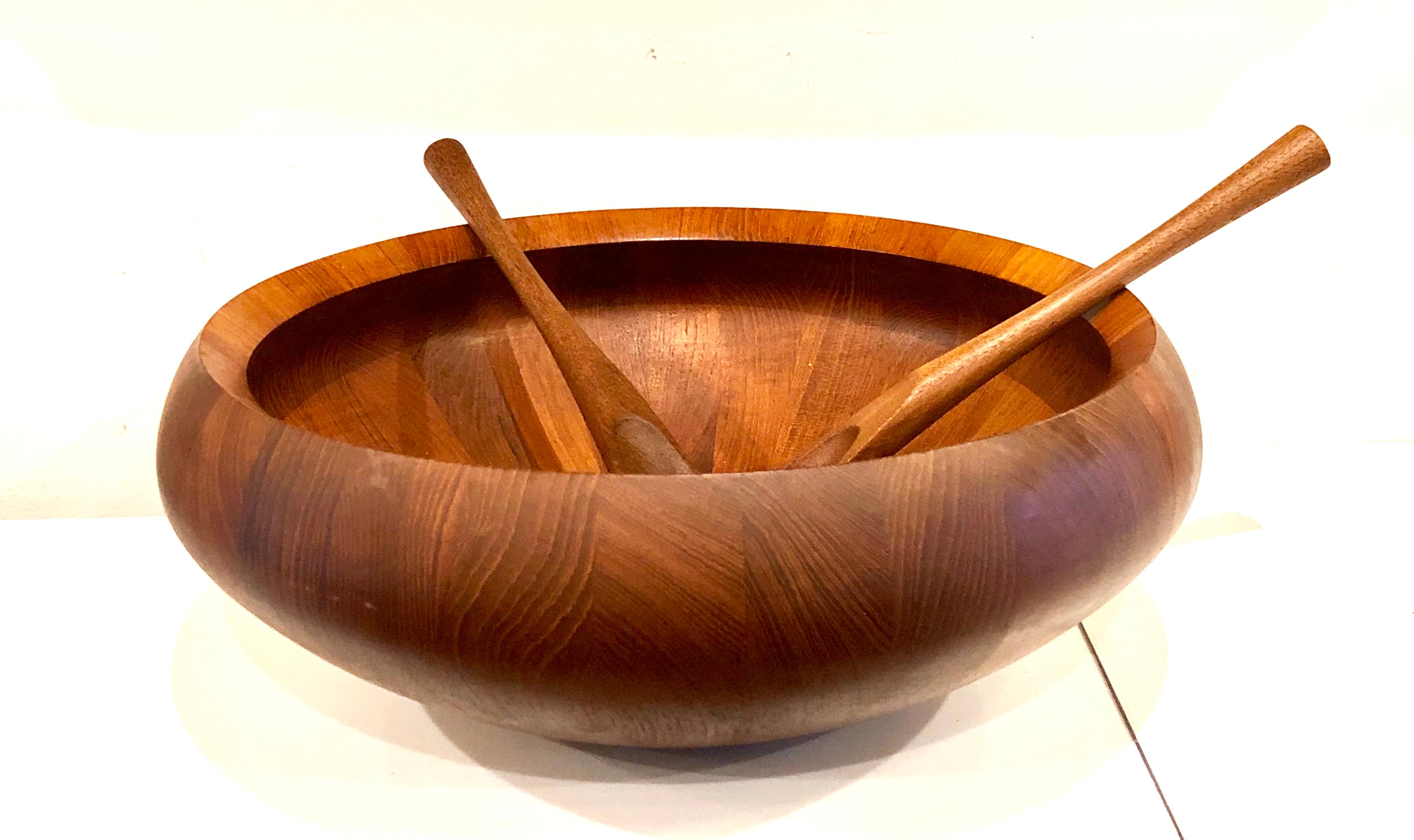 Beautiful and rare X-large salad bowl designed by Quistgaard for Dansk early production, made in Denmark with its original servers it’s been oiled, with mineral oil very nice condition and great design.