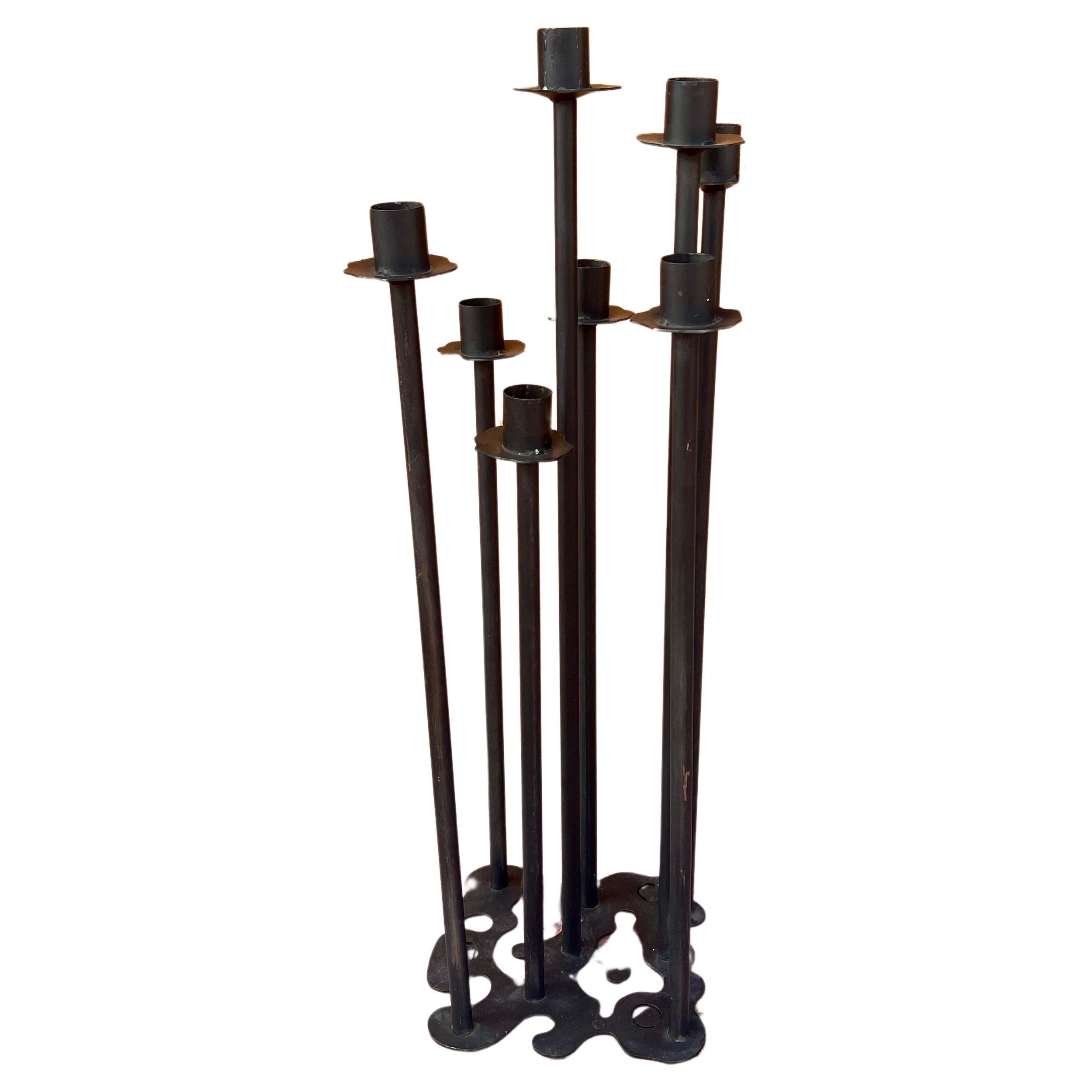 1960s California artisan floor-standing candelabra crafted of steel with a free-form base, a great impressive piece.