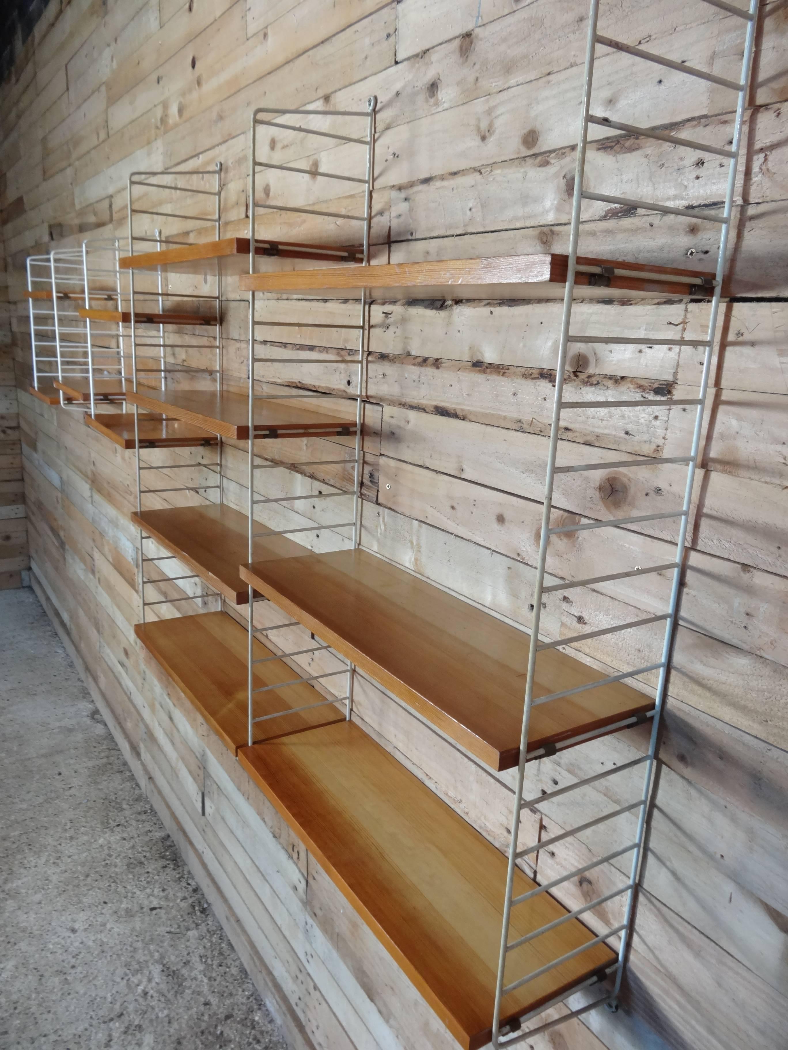 Large retro vintage shelving unit by Nisse Strinning for String, 1960s the string wall system was designed in 1949 and over the years has evolved from being innovative to one of the staples of Scandinavian design. Each component of the system is