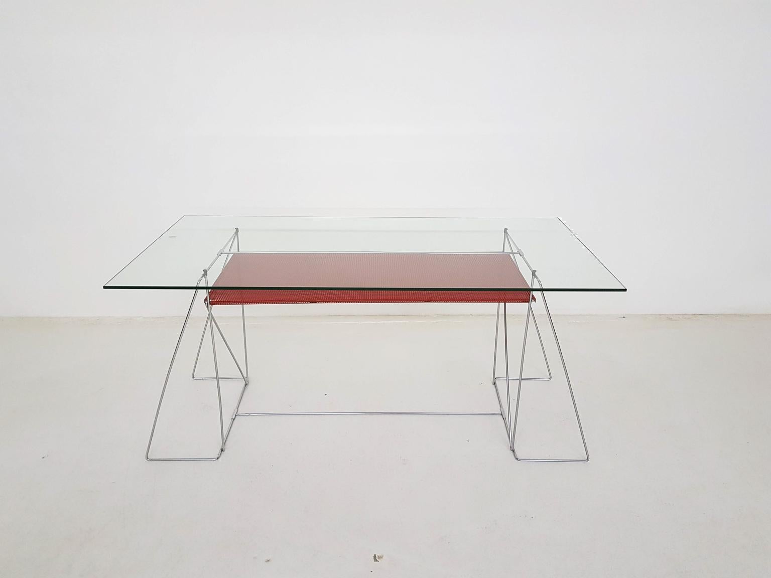 Danish modern X-Line desk or dining table by Niels Jørgen Haugesen for Hybodan, made and designed in Denmark in 1977.

Geometric Scandinavian Modern wire frame dining table or desk. This Danish table is made of a metal frame with a glass top and a