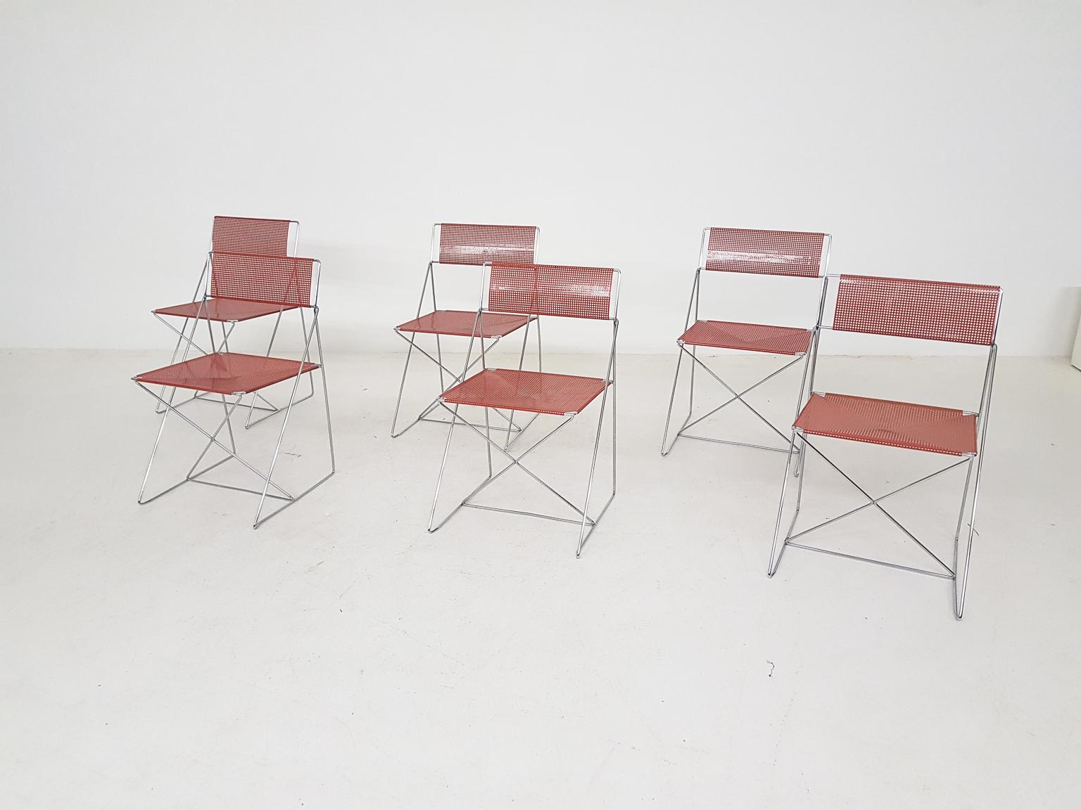 Danish modern X-line stacking or dining chairs by Niels Jørgen Haugesen for Hybodan, made and designed in Denmark in 1977.

Geometric Scandinavian modern wire frame dining chairs. Items are from the X-line series by Danish designer Niels Jørgen