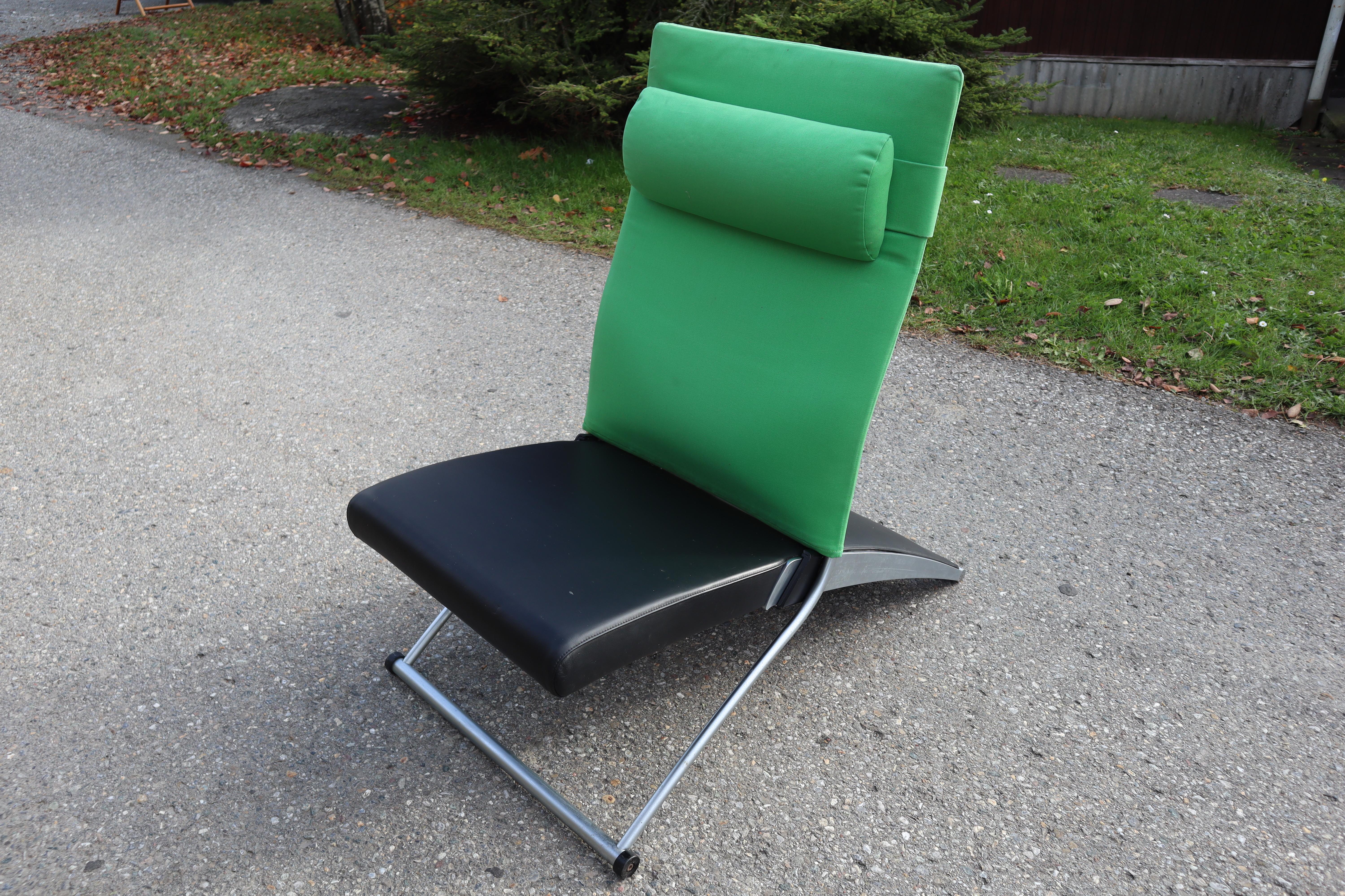The highly awarded, sleek and functional X Chair by Joachim Nees for Interprofil, Germany.

Silver painted metal frame with black leather upholstered seat and green fabric upholstered back rest.

A special upholstery support in the lumbar region and
