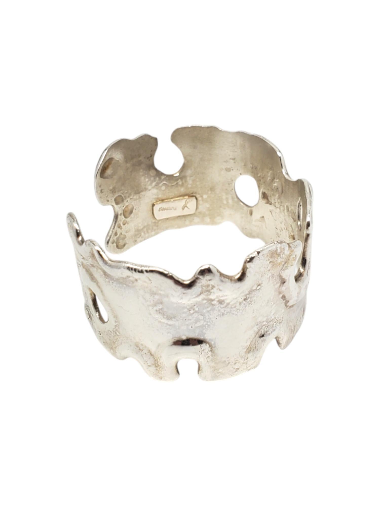 X Sterling Silver Molten Cuff Bracelet -

This vintage bracelet features a melted style cuff in heavy sterling silver by X.

Size: fits up to 6