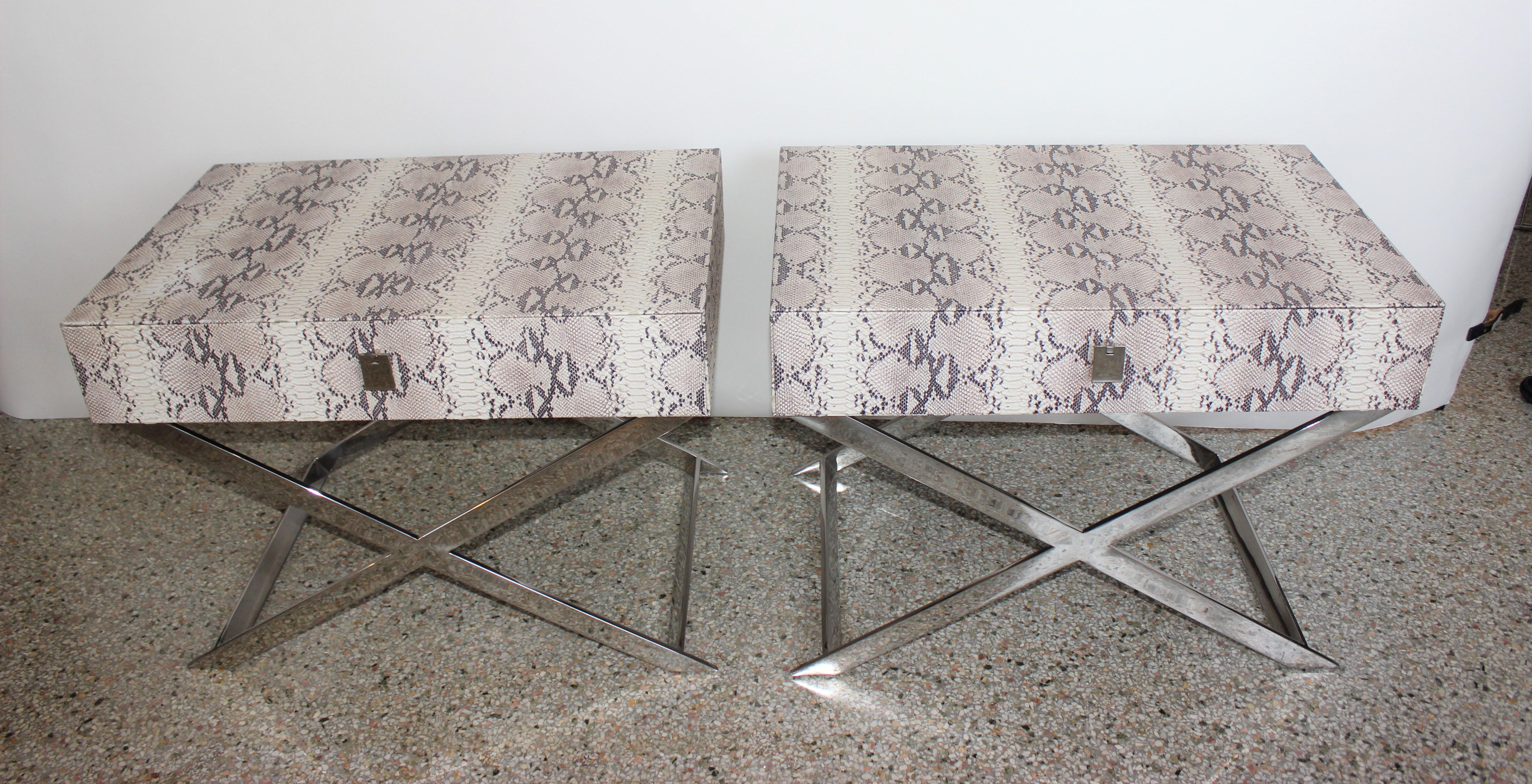 Chic pair of side tables in faux python. Single drawer with x-legs in polished chrome.