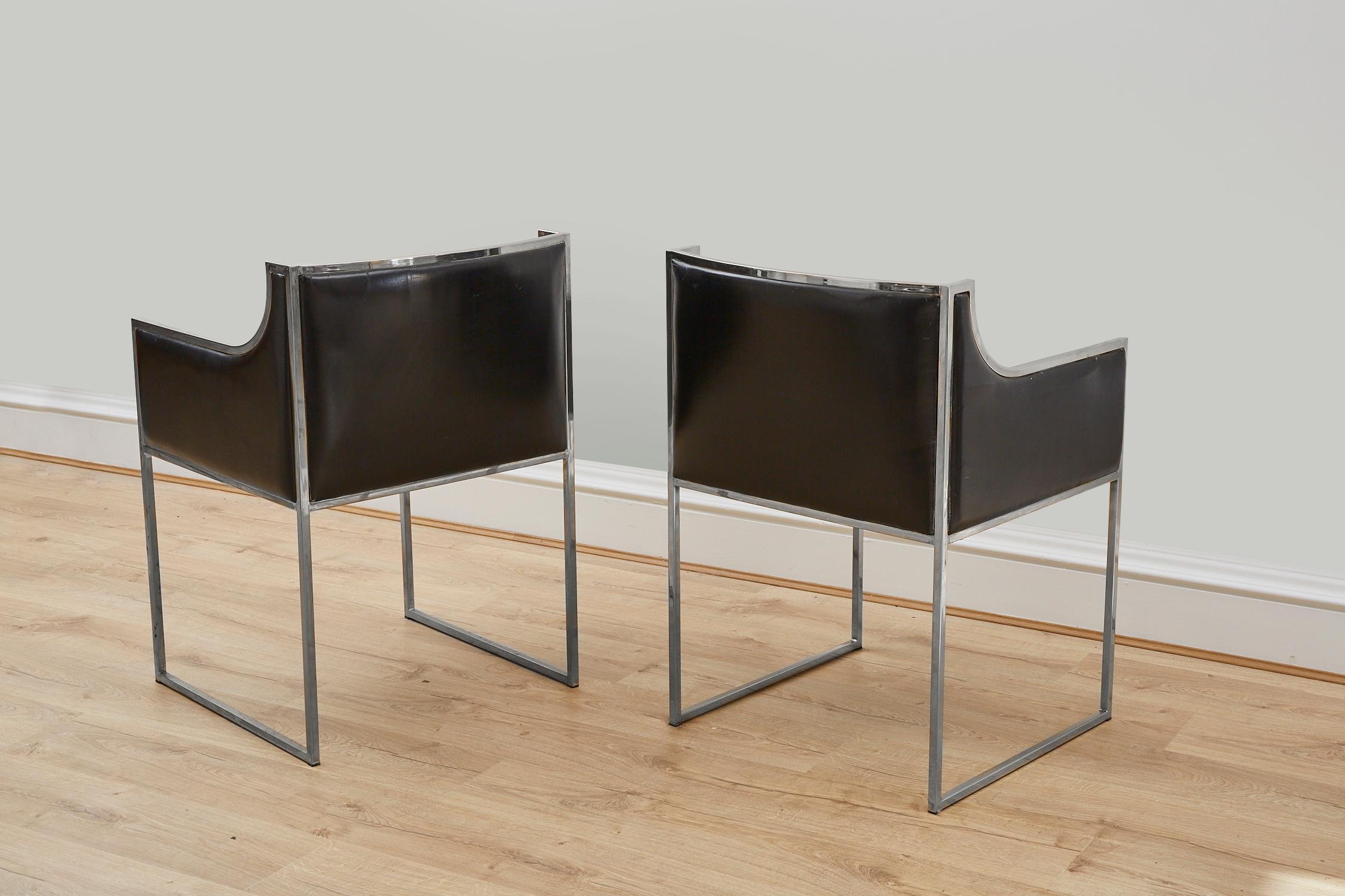 A pair of 1970s Italian armchairs with chrome frame and original black leather upholstery attributed to Willy Rizzo. 
Chrome frame shows some marks and leather upholstery shows marks and fading consistent with age and use.
 
