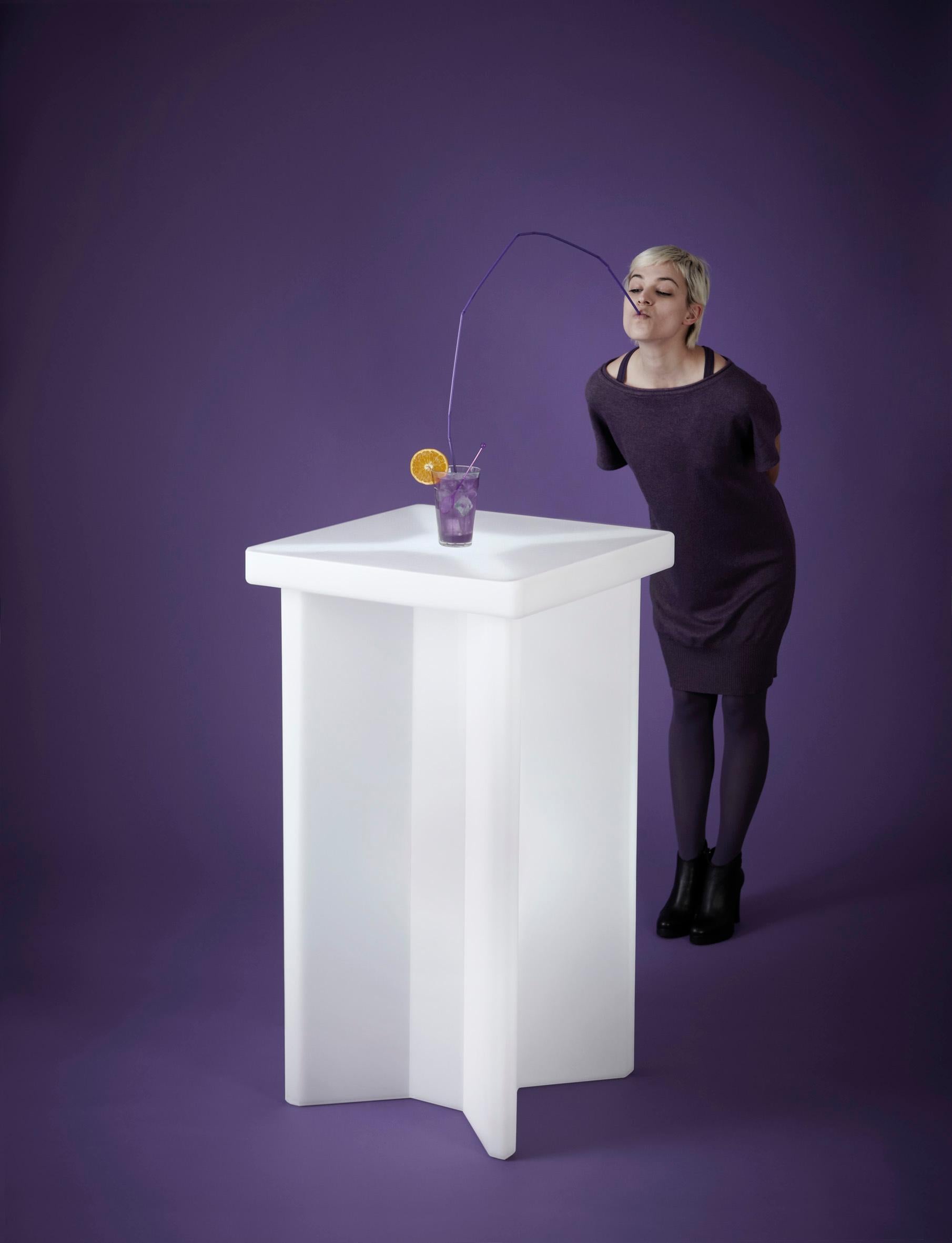 X2 Jet Black Table by SLIDE Studio
Dimensions: D 60 x W 60 x H 110 cm.
Materials: Polyethylene.
Weight: 15 kg.

Available in different color options. A glass top is also available. Prices may vary. This product is suitable for indoor and outdoor