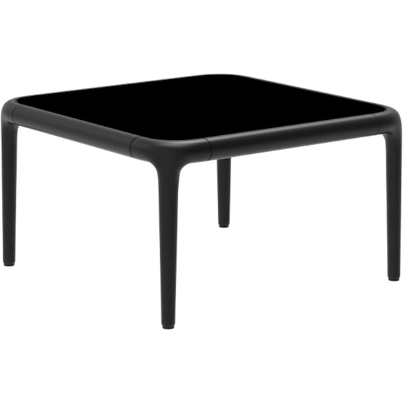 Xaloc black coffee table 50 with glass top by Mowee.
Dimensions: D50 x W50 x H28 cm
Materials: Aluminum, tinted tempered glass top.
Also available in different aluminum colors and finishes (HPL Black Edge or Neolith).

Xaloc synthesizes the