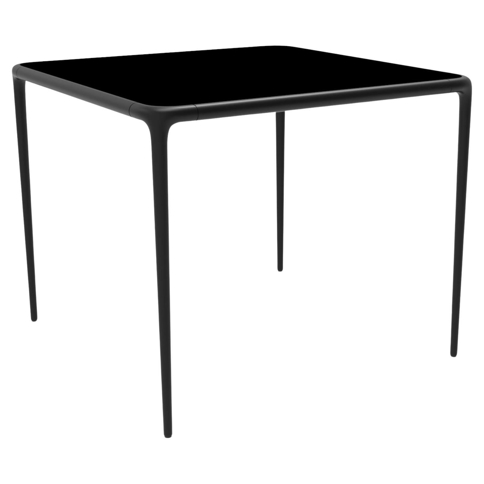 Xaloc Black Glass Top Table 90 by Mowee For Sale
