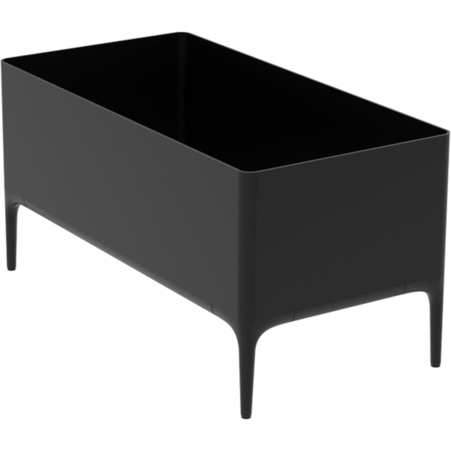 Xaloc black planter by MOWEE
Dimensions: D90 x W45 x H45 cm
Material: Aluminium
Weight: 11 kg
Also available in different colours and finishes. 

 Xaloc synthesizes the lines of interior furniture to extrapolate to the exterior, creating an
